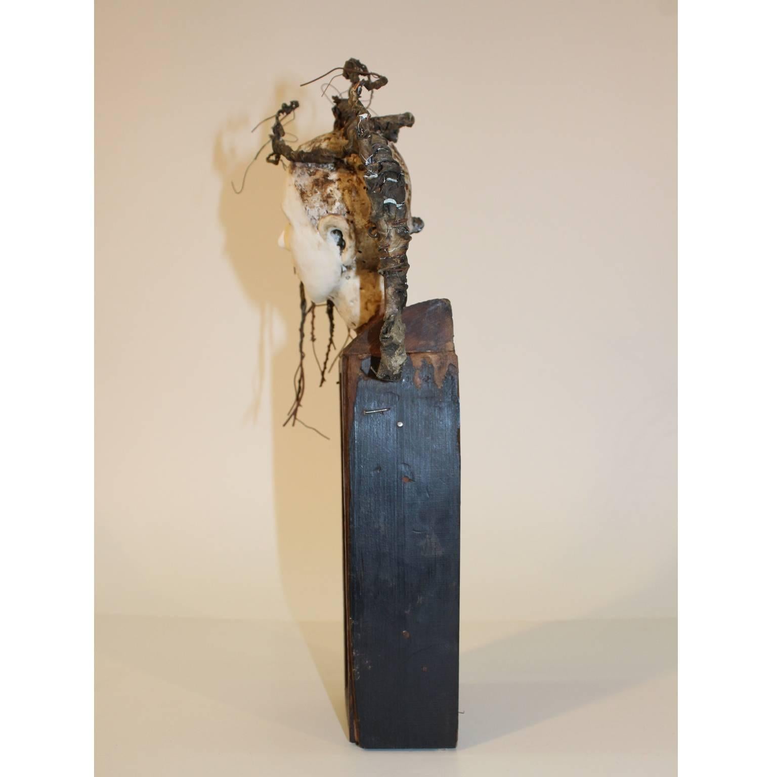 Produced in 2012 by New-Orleans artist Cathy Rose. This sculpture is an assemblage of wood, found objects and a porcelain female head. In excellent condition and signed on the back. 

110268.