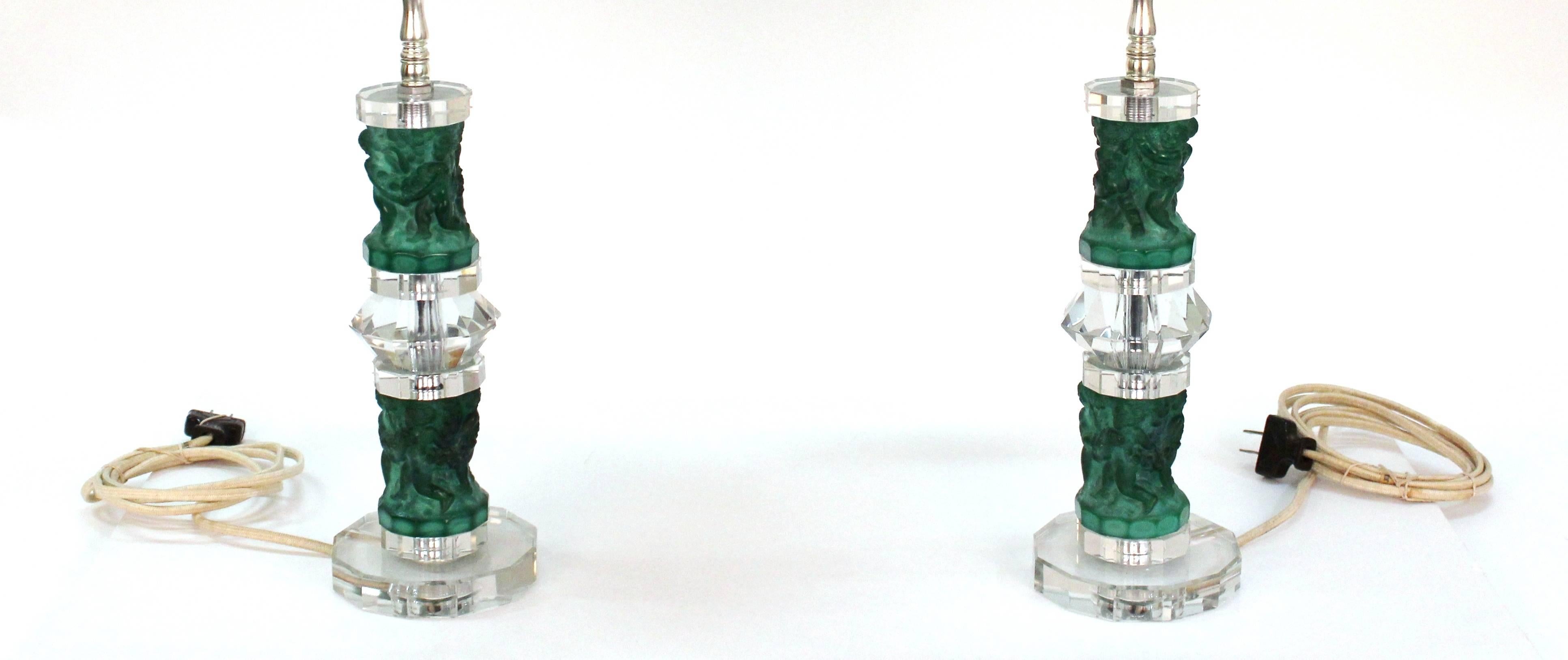 Pair of Art Deco era Czechoslovakian table lamps, produced circa 1930s, featuring reliefs with dancing classical figures and floral swags in molded glass and faceted crystal mounts. Includes new silver shades. Very good vintage condition, consistent