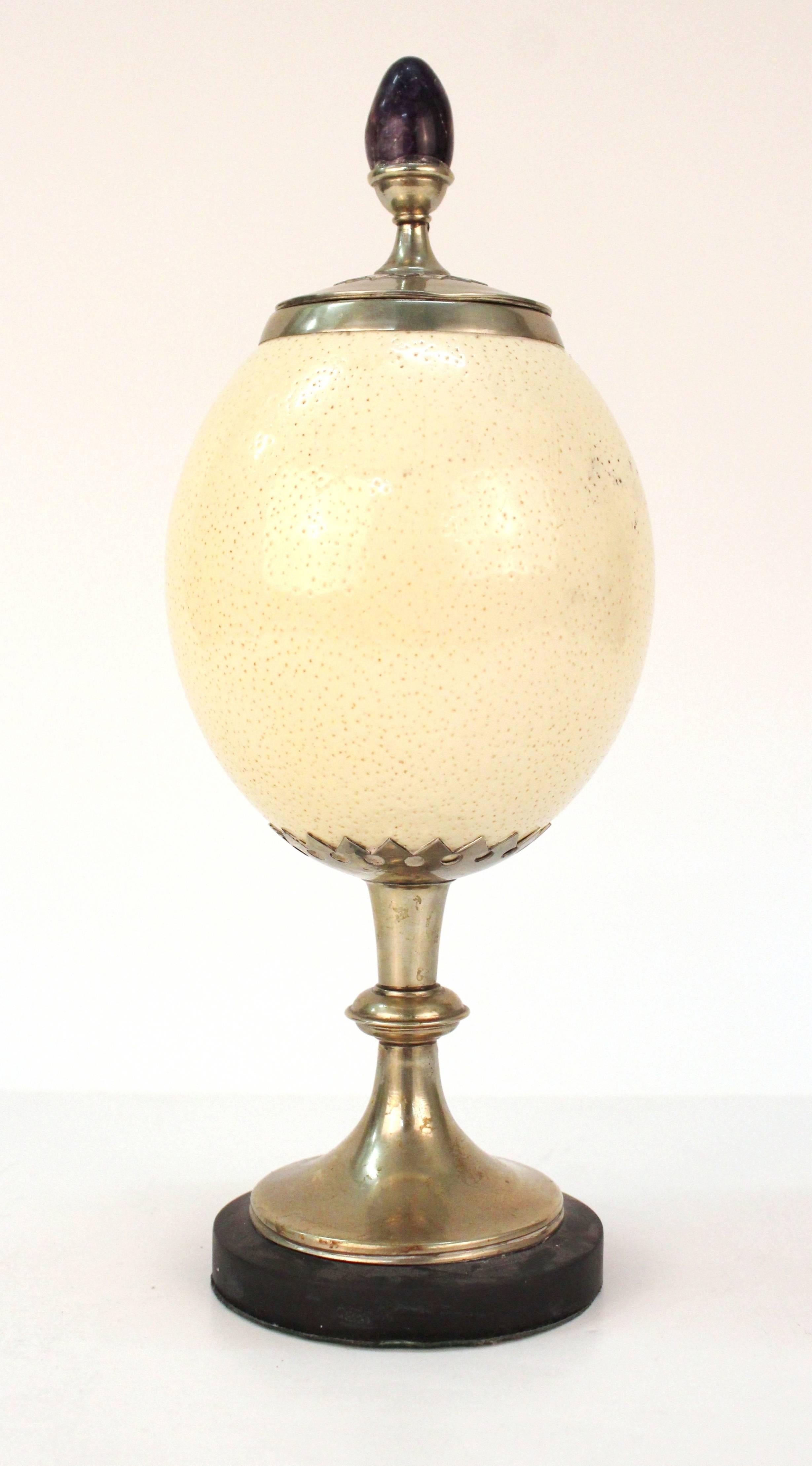 Ornamental standing urn by Anthony Redmile, produced circa 1970s, ostrich egg with silver plate mounts, lid with egg-shaped amethyst. Very good vintage condition, consistent with age and use.

110366