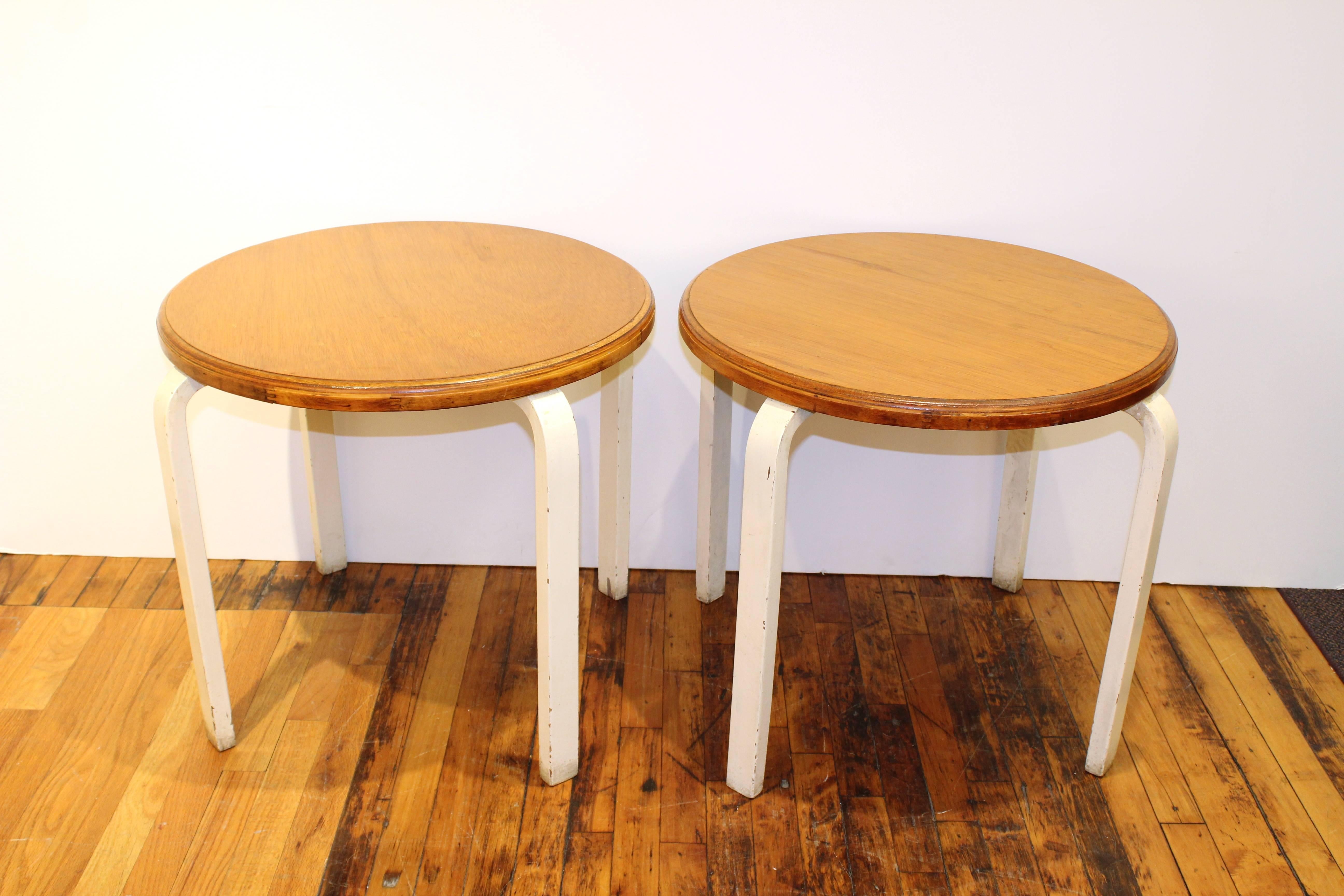 Pair of side tables designed by Alvar Aalto with circular light wood tops and white painted steam bent legs. 

110477
