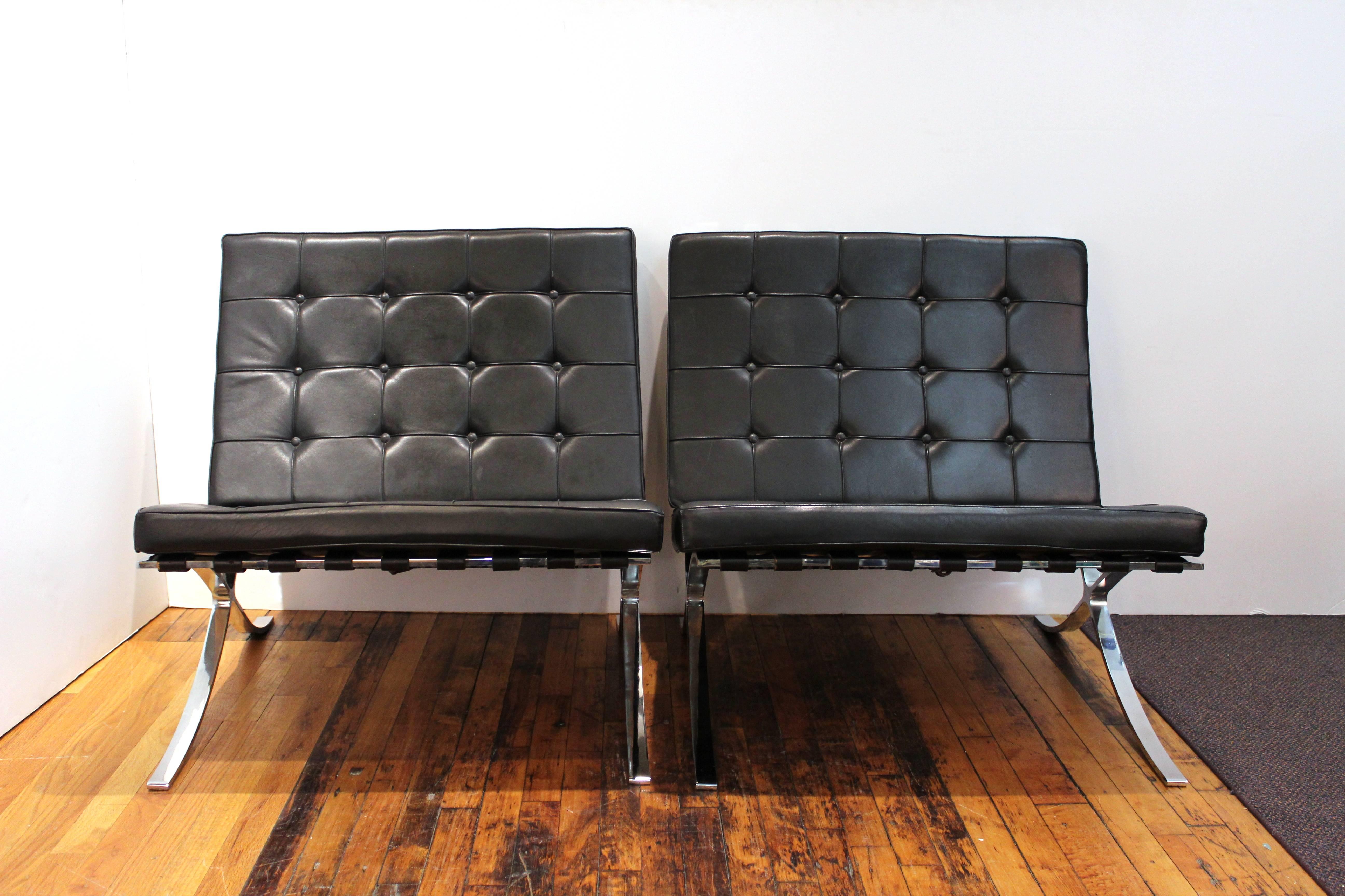 A pair of Barcelona chairs, originally designed in 1929 by Ludwig Mies van der Rohe and Lilly Reich for the German Pavilion at the International Exposition. Later produced by Knoll after they purchased the rights in 1953. This pair dates from circa