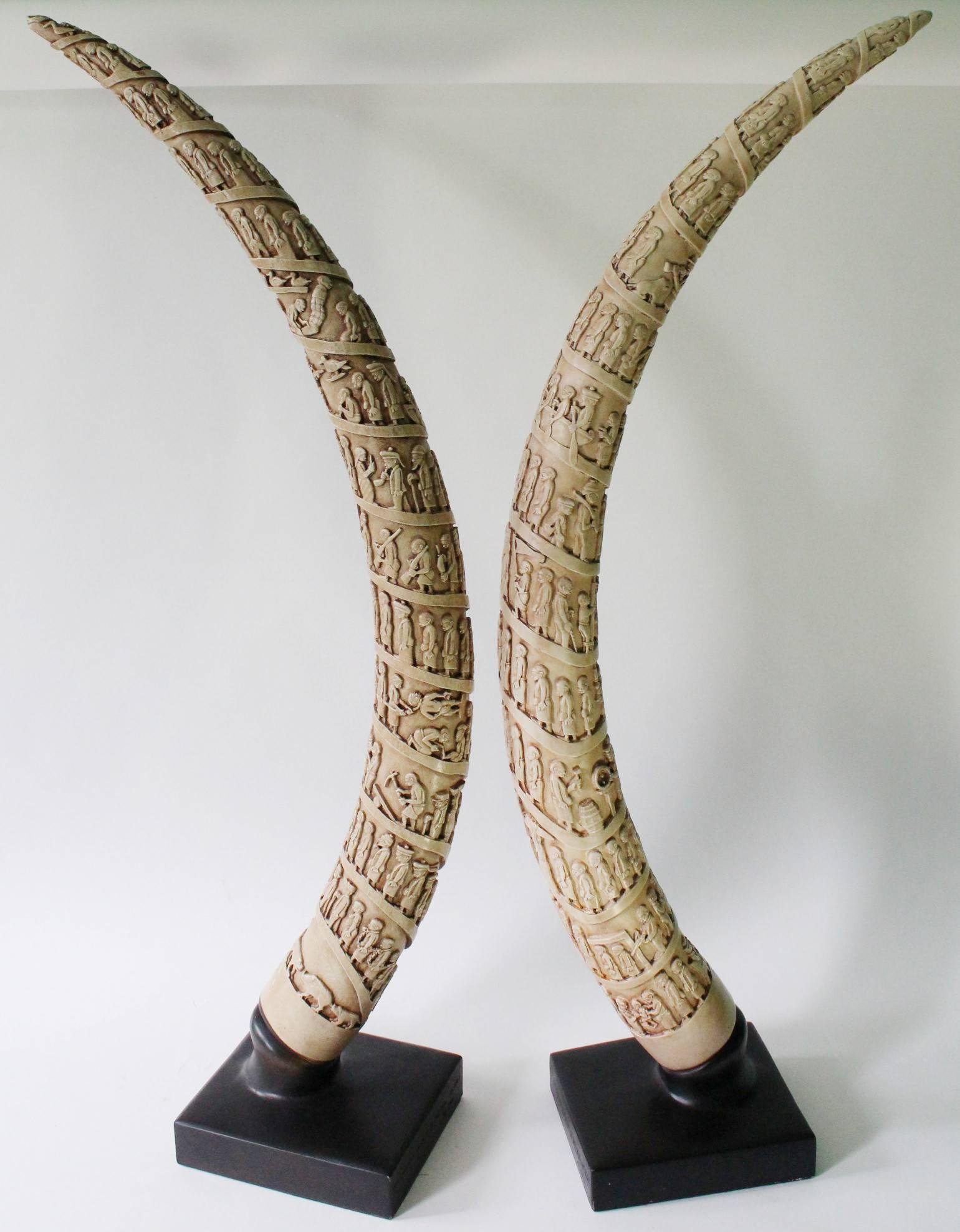These tusks were made for the Museum of Natural History in 1986. Each consists of molded plaster which has been painted to make the tusks resemble ivory. The carvings feature ritual motifs. Each is in very good condition.

110512.