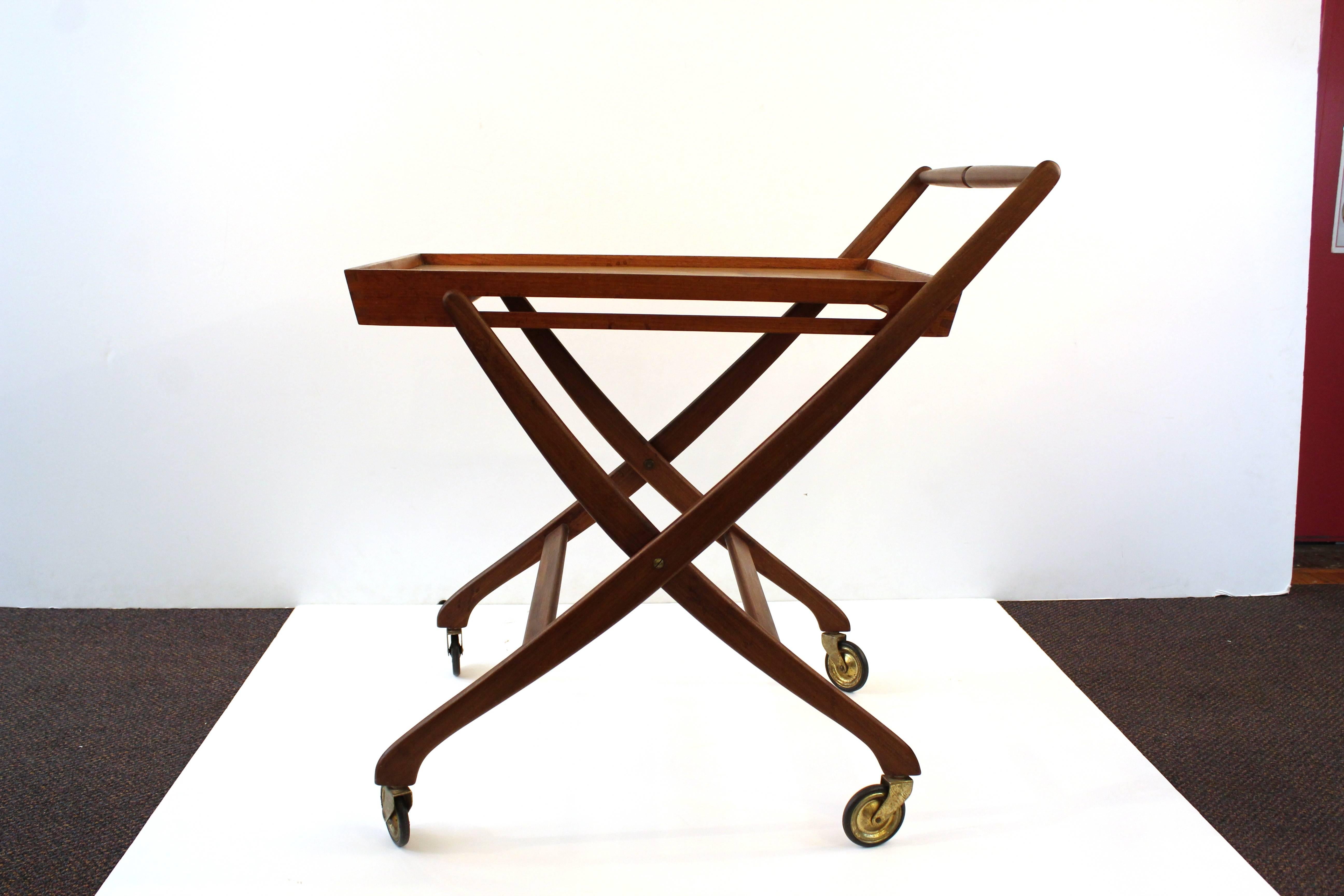 A simple teak folding bar cart, produced in Denmark. 

110514.