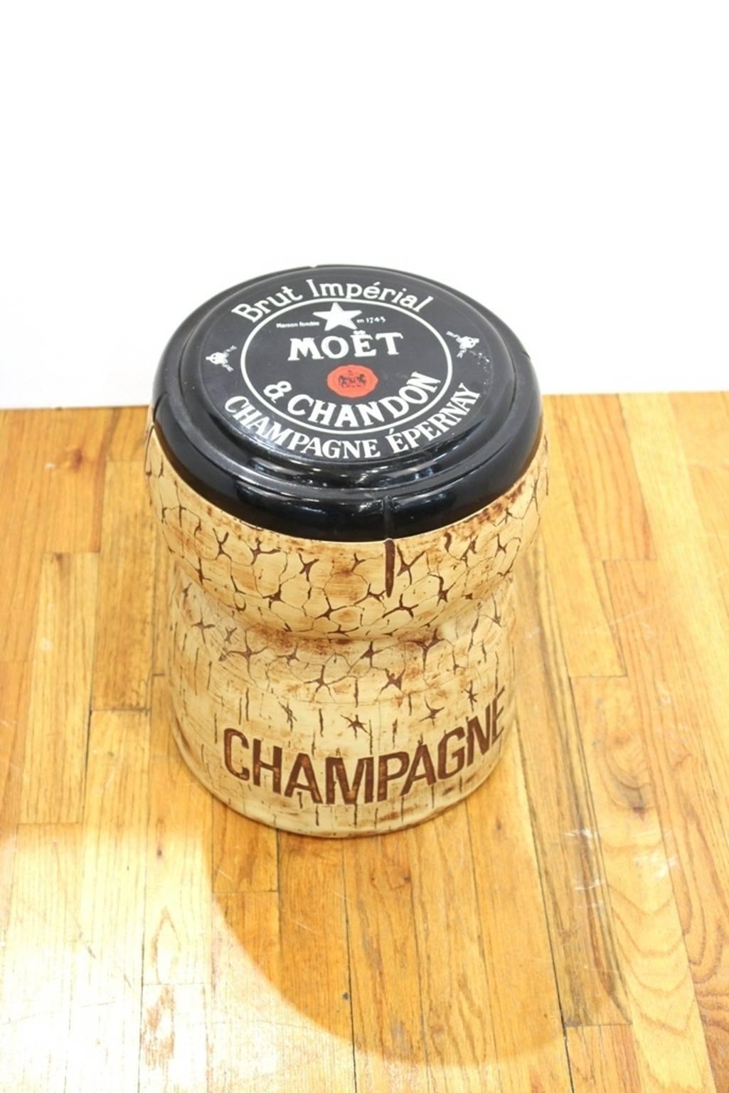 A Moet and Chandon ice cooler bucket in the form of a large cork. In very good vintage condition. Dated and stamped on the bottom [1987] [Think Big NYC].