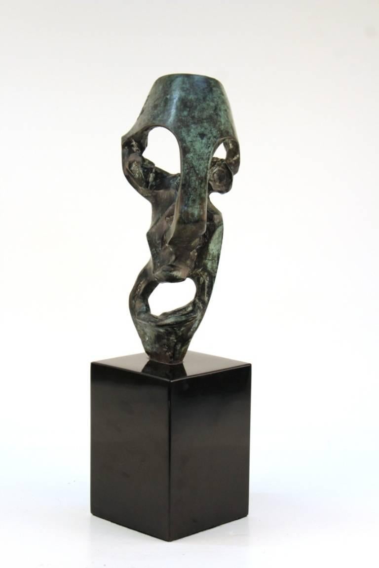This abstract sculpture from late 20th century is crafted from bronze and marble and features a large pedestal base. Signed 'Know LKS' 110801.