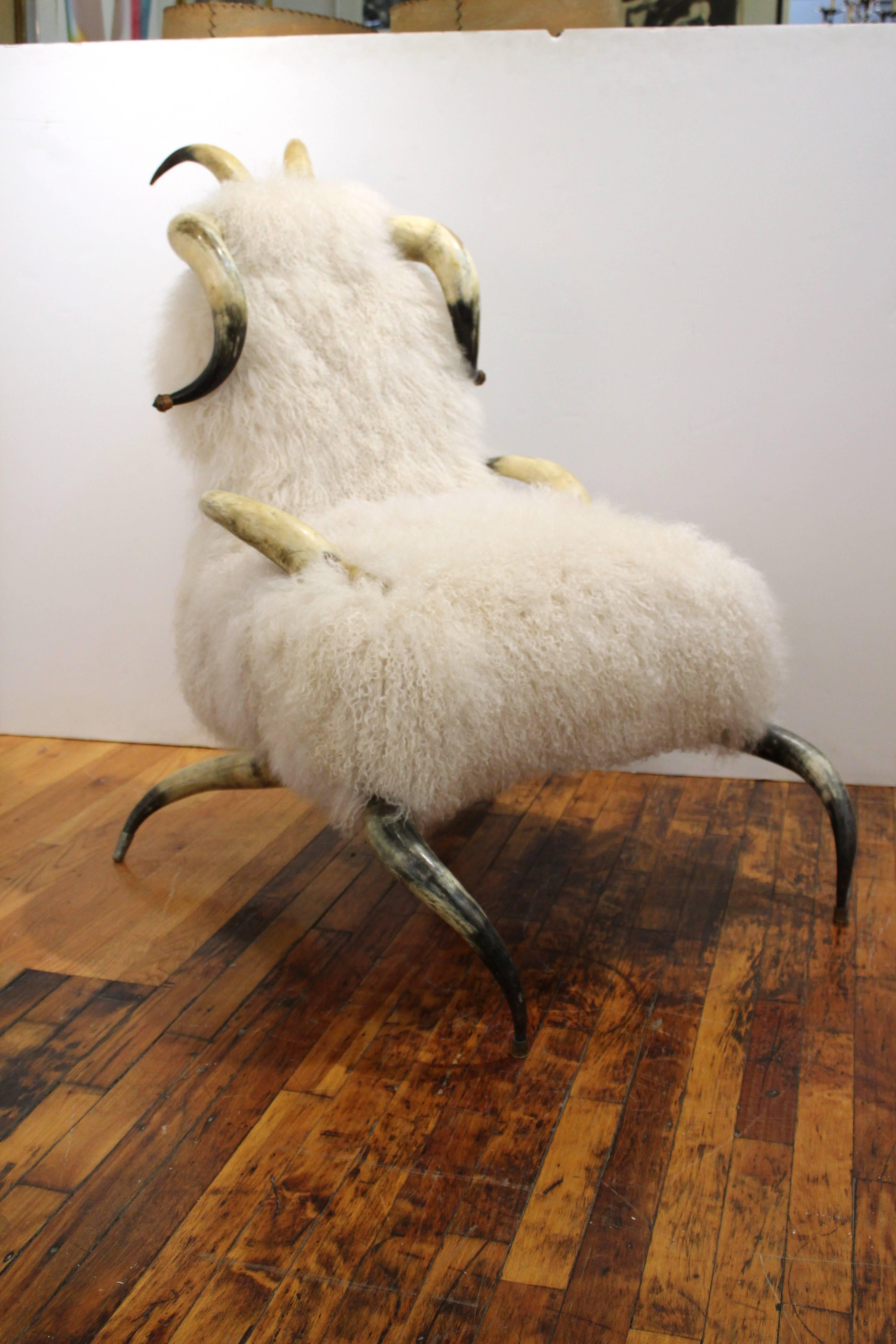 Vintage armchair made out of horns recently re-upholstered in chic Mongolian lamb wool. Some wear due to age and use but in overall good condition.
