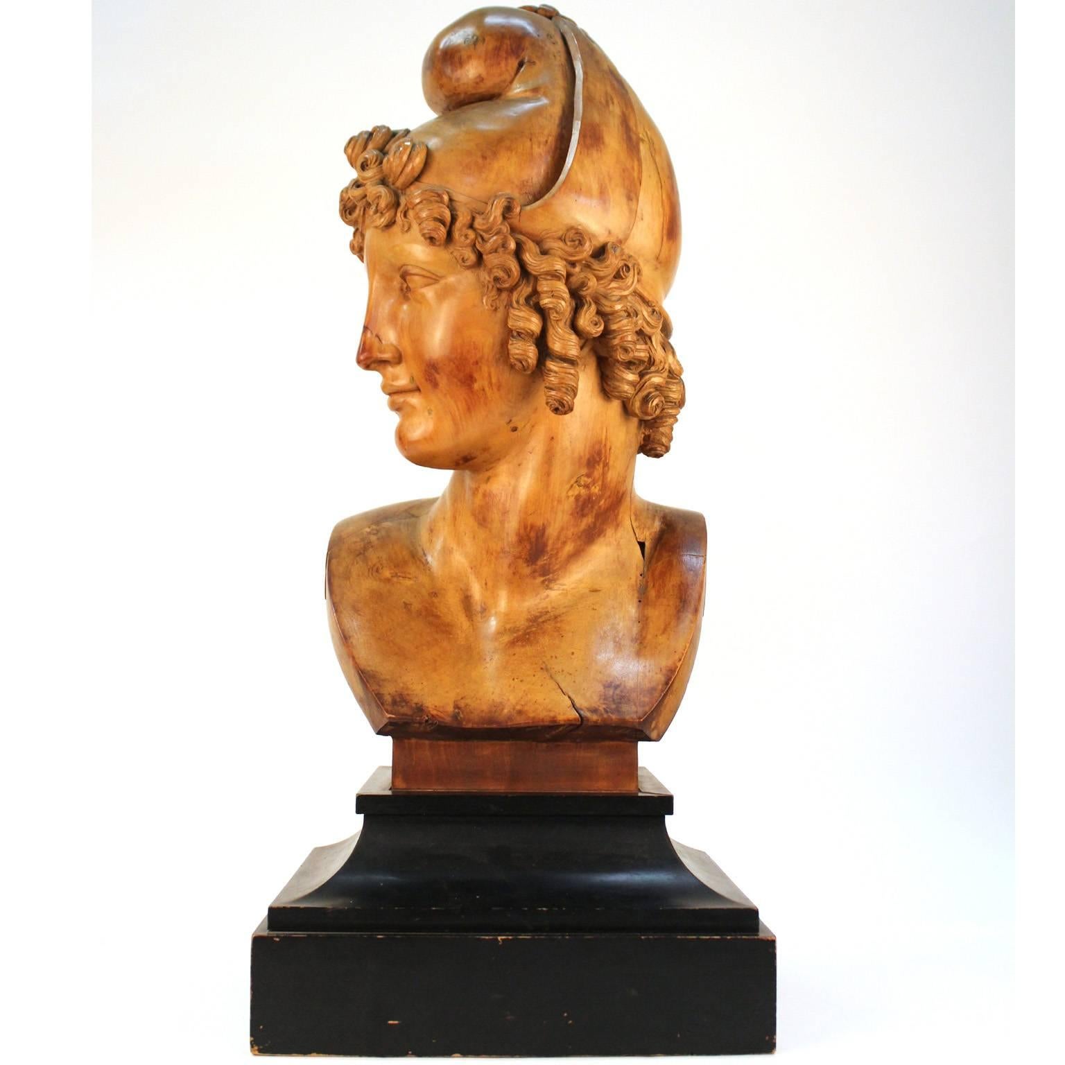 Italian neoclassical carved olive wood sculpture depicting the head of Paris, circa 1810, after Italian artist Antonio Canova. Examples are known in marble and plaster in multiple major museums. Good condition; some age, cracks, and minor early
