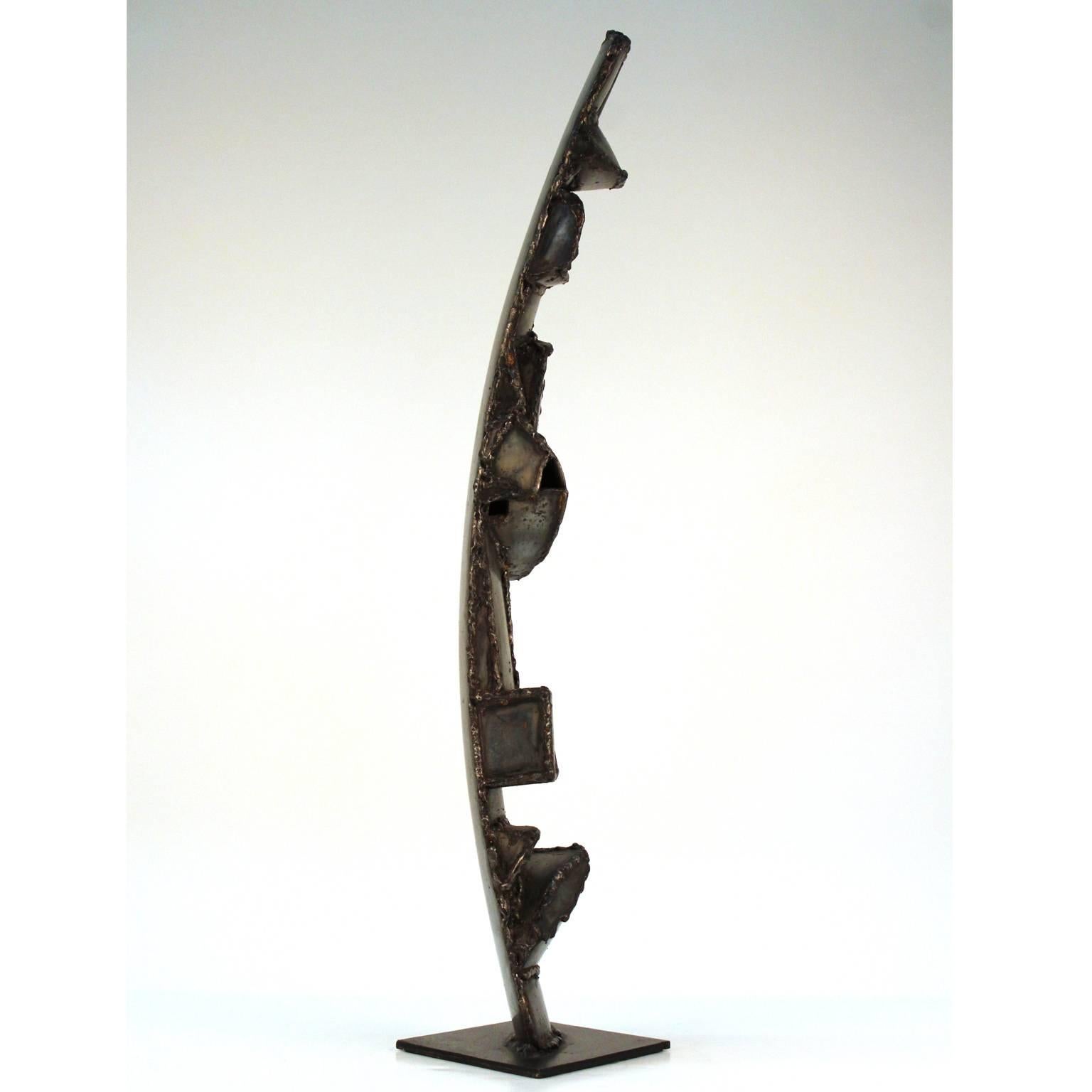 A Brutalist abstract sculpture made from welded car bumpers by Jason Seley (1919-1983), sculptor and dean of the Cornell University College of Architecture, Art and Planning. Excellent original condition, with some wear of age. Serial number etched