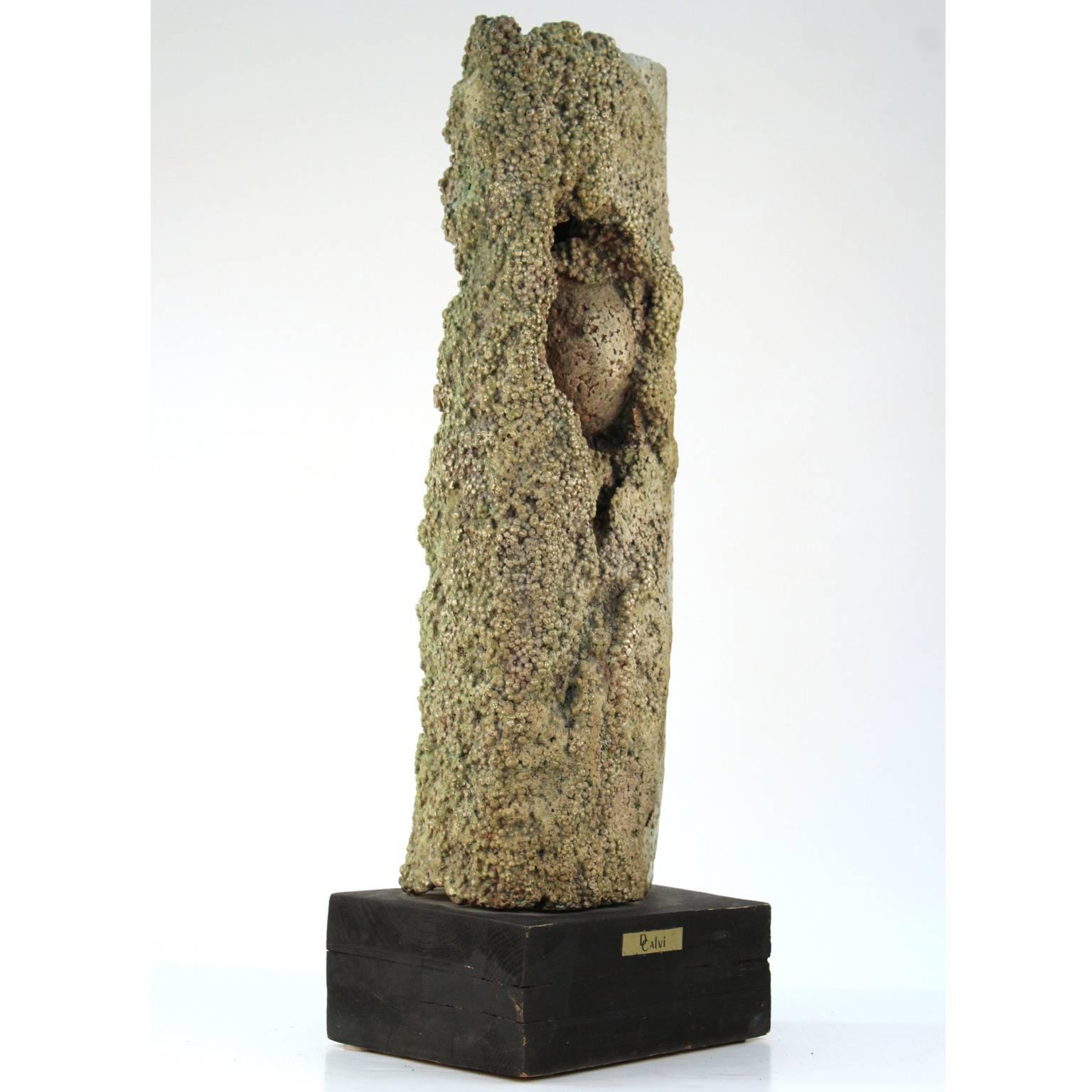 A 1960s Brutalist style abstract sculpture in cast aluminum made by Dcalvi. Plaque mounted on painted wood base marked Dcalvi". Great original condition.
