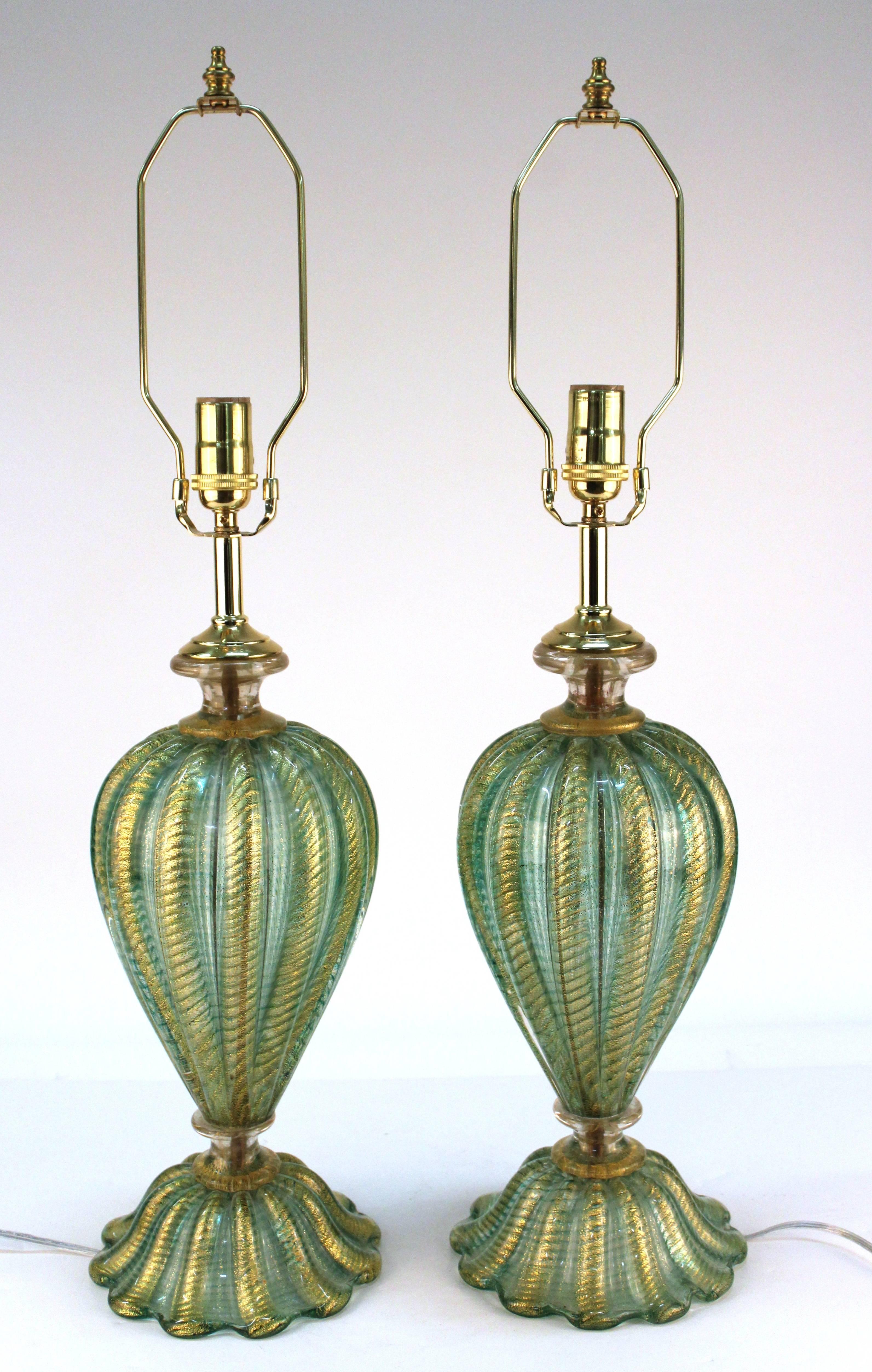 Gold flecks are present throughout these lobed Barovier and Toso Murano glass lamps. These date from the mid-20th century, circa 1960s and are in excellent vintage condition consistent with age and use. 110896.