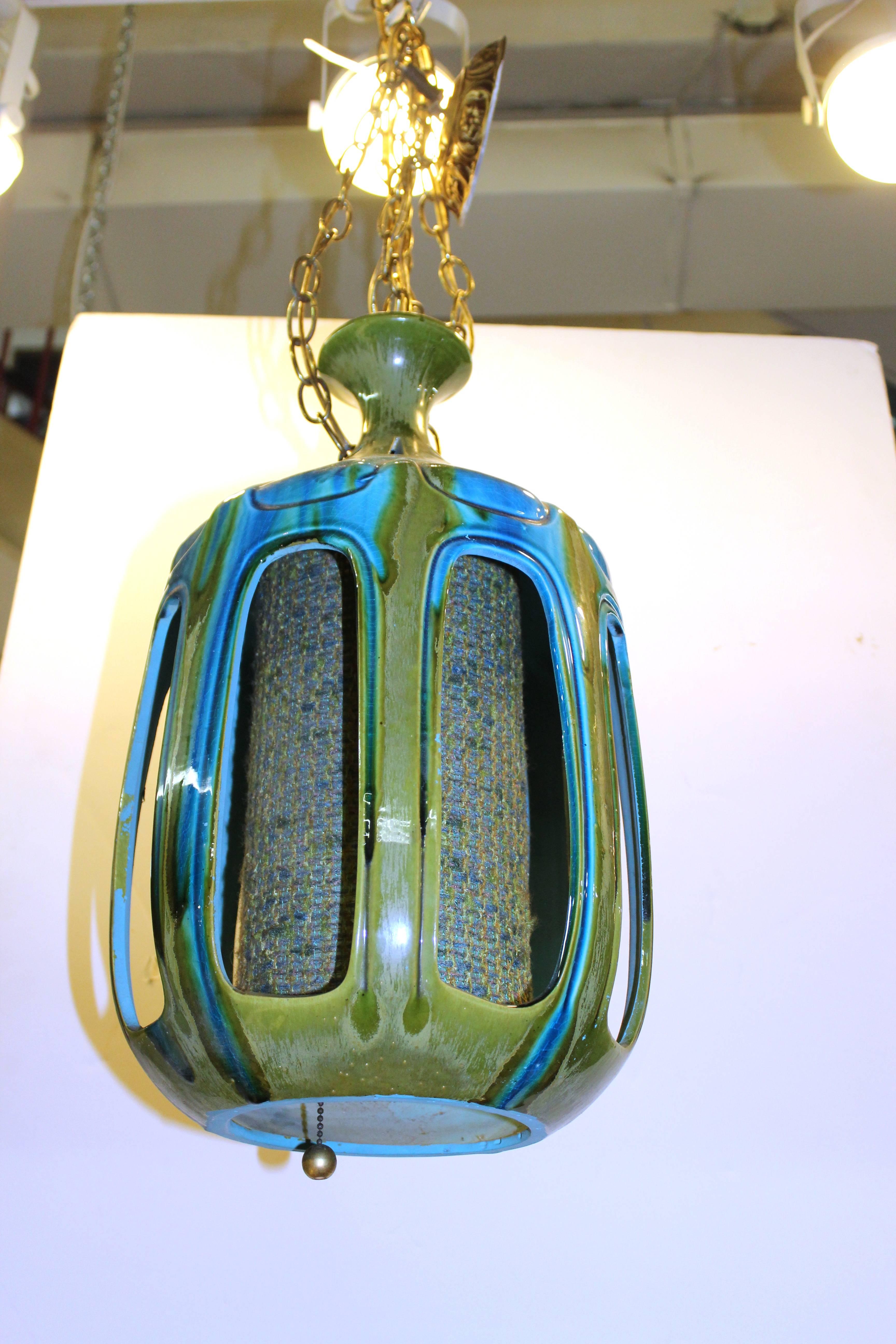Mid-century drip glaze blue and green ceramic pendant with matching tweed centre accent.