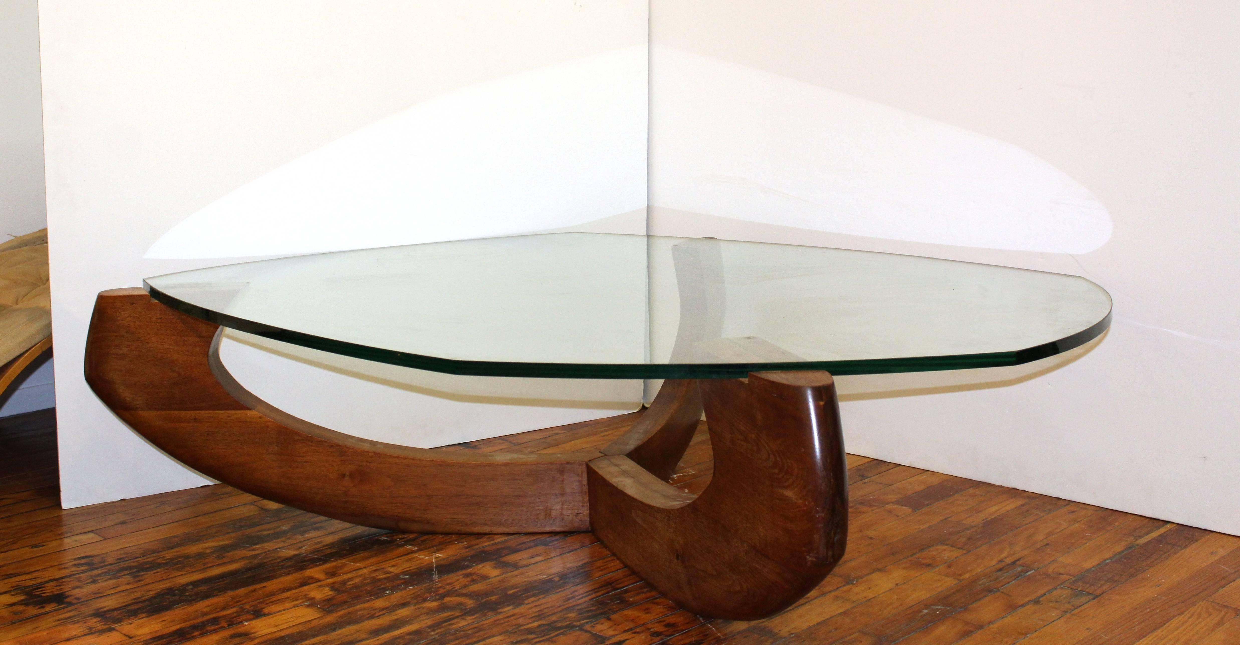 A large modern coffee table by Samson Berman. Organic shaped glass mounted onto a teak base. Despite some minor scratches to the glass the table is in good vintage condition.