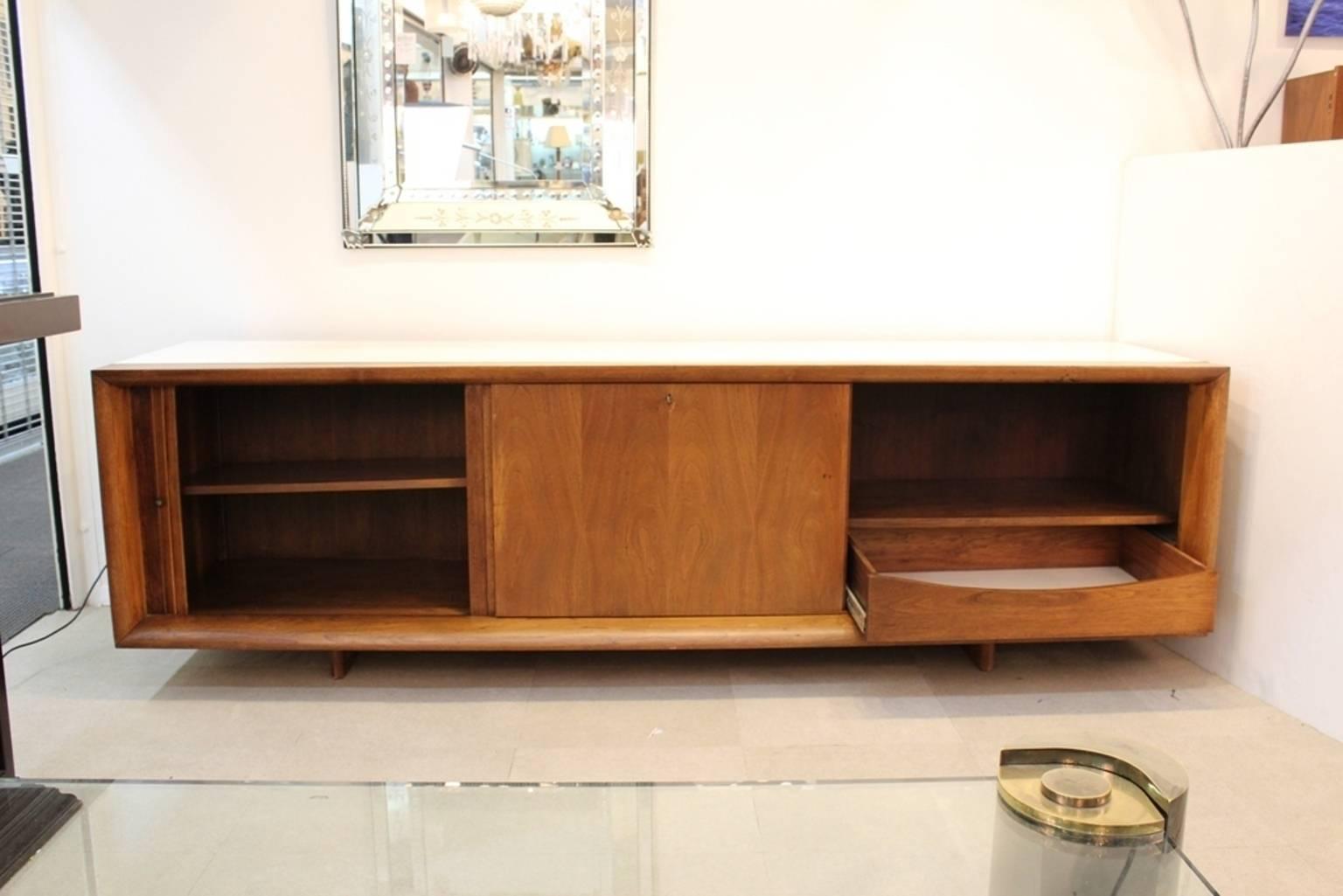 A commode designed by Samson Berman in teak with a white top. Artfully crafted with multiple drawers, doors and compartments. Some wear appropriate to age and use but in overall good vintage condition.