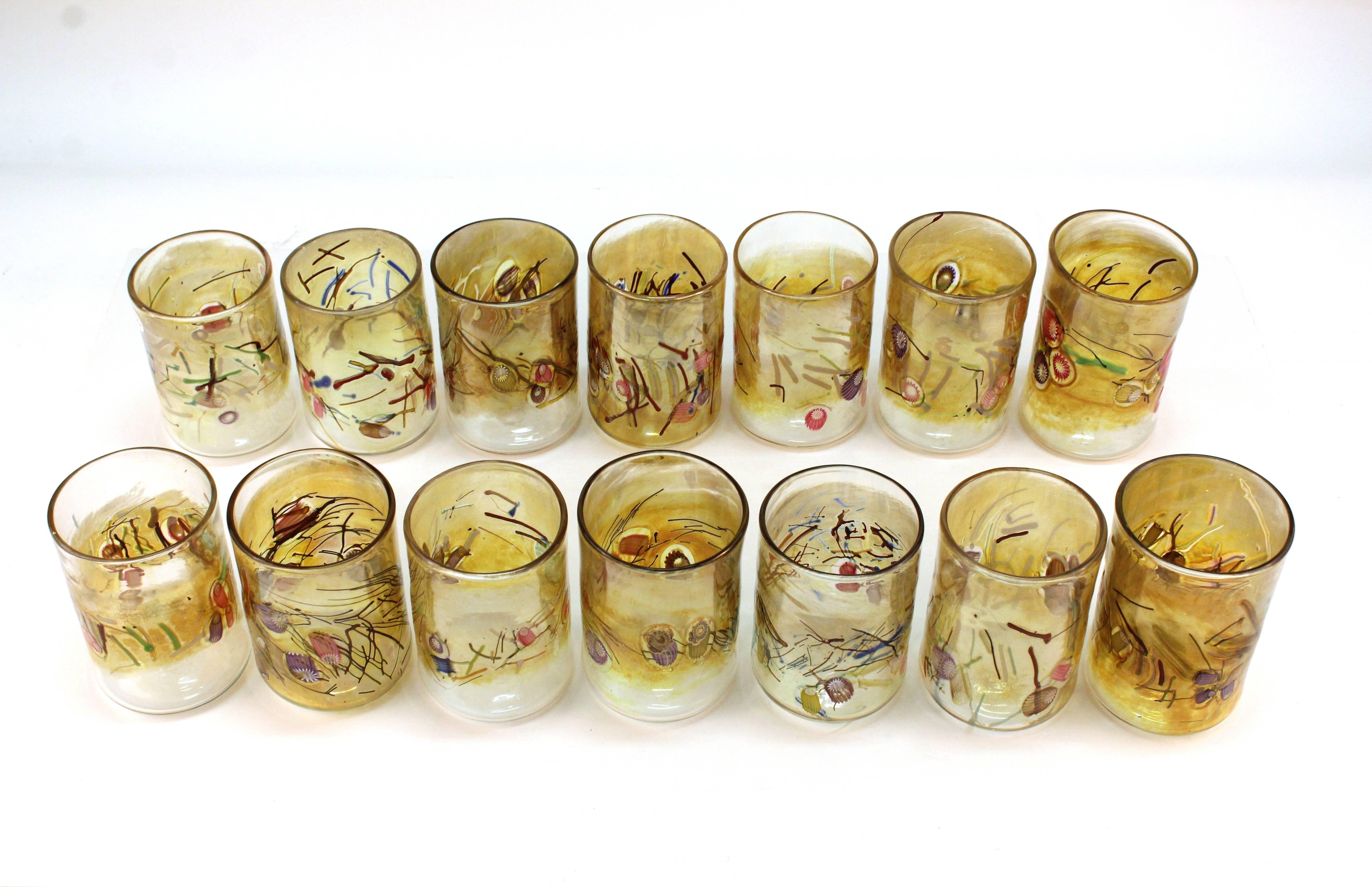 Set of 14 sea themed glasses by contemporary Hawaiian artist Paul Counts. Each glass was designs with faux coral, seaweed and shells made from murine canes. Signed PAC on bottom of each glass. In very good condition.