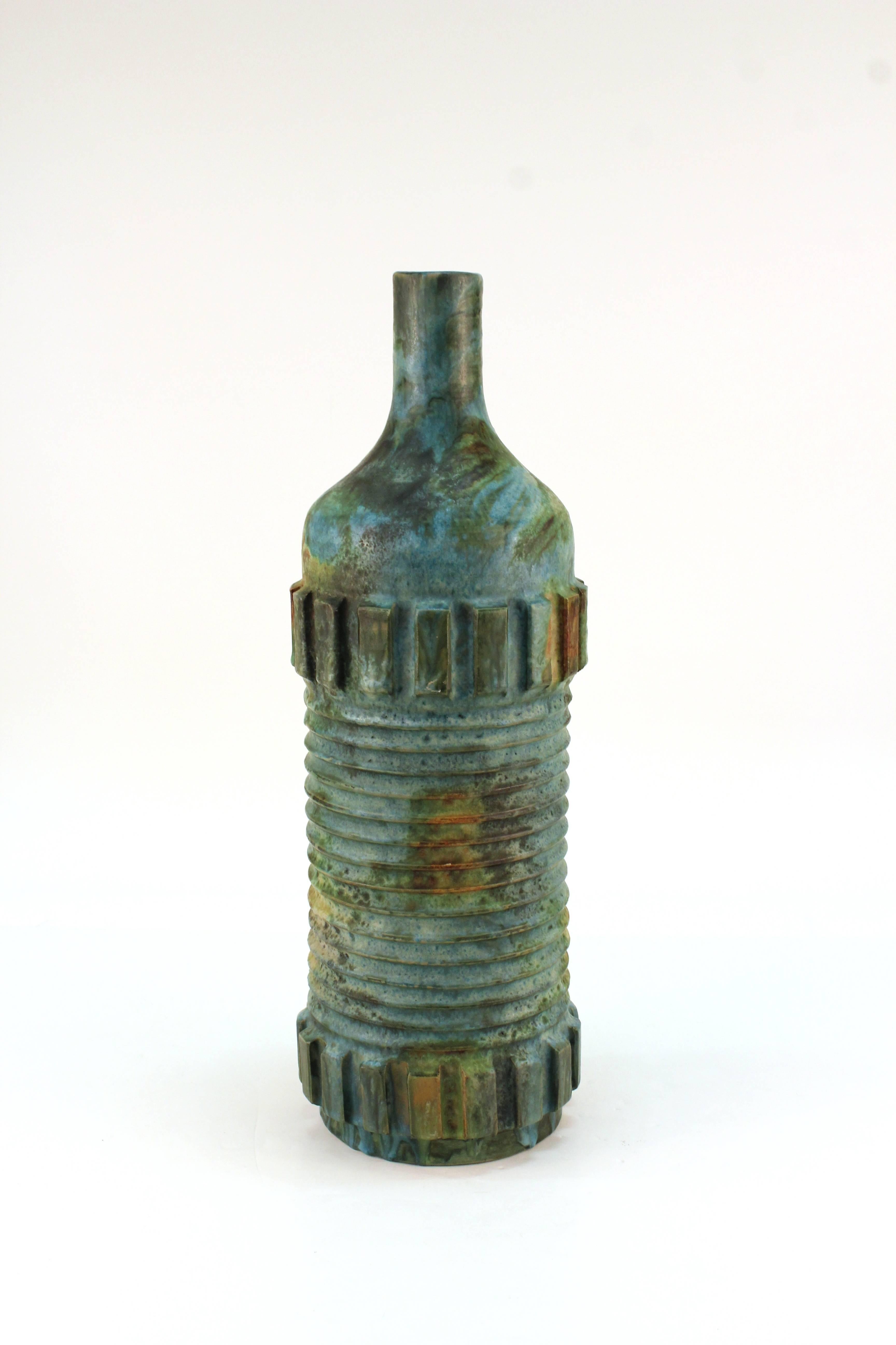 A ceramic bottle vase designed by Alvino Bagni for Raymor in 1960s, Italy. Glazed in Bagni's unique "sea garden" colors. In excellent condition.