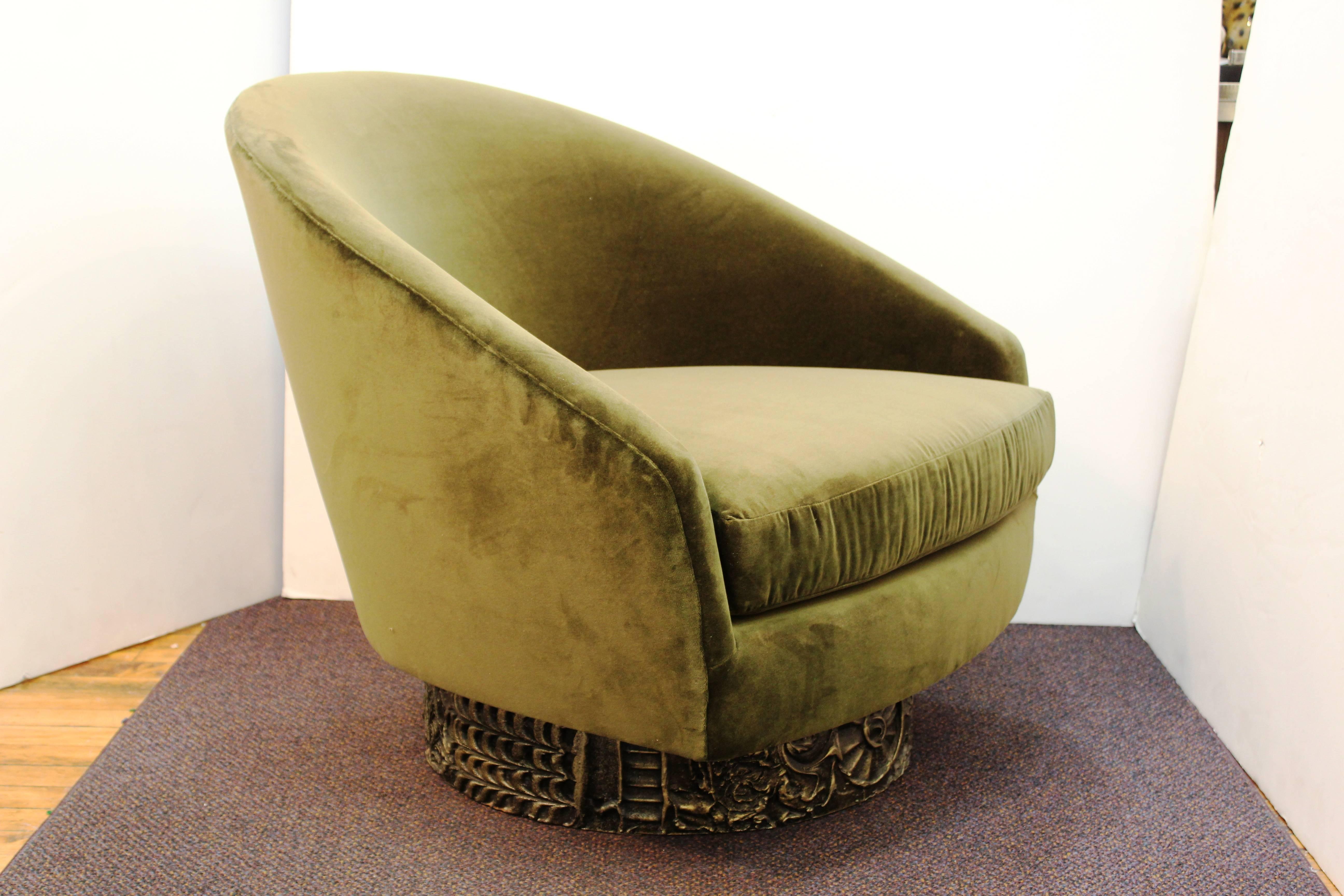 A chair by Adrian Pearsall produced during the 1970s. The cast resin base that is highlighted in gold allows the chair to swivel and rock. The chair has been recently re-upholstered in velvet and remains in excellent condition.