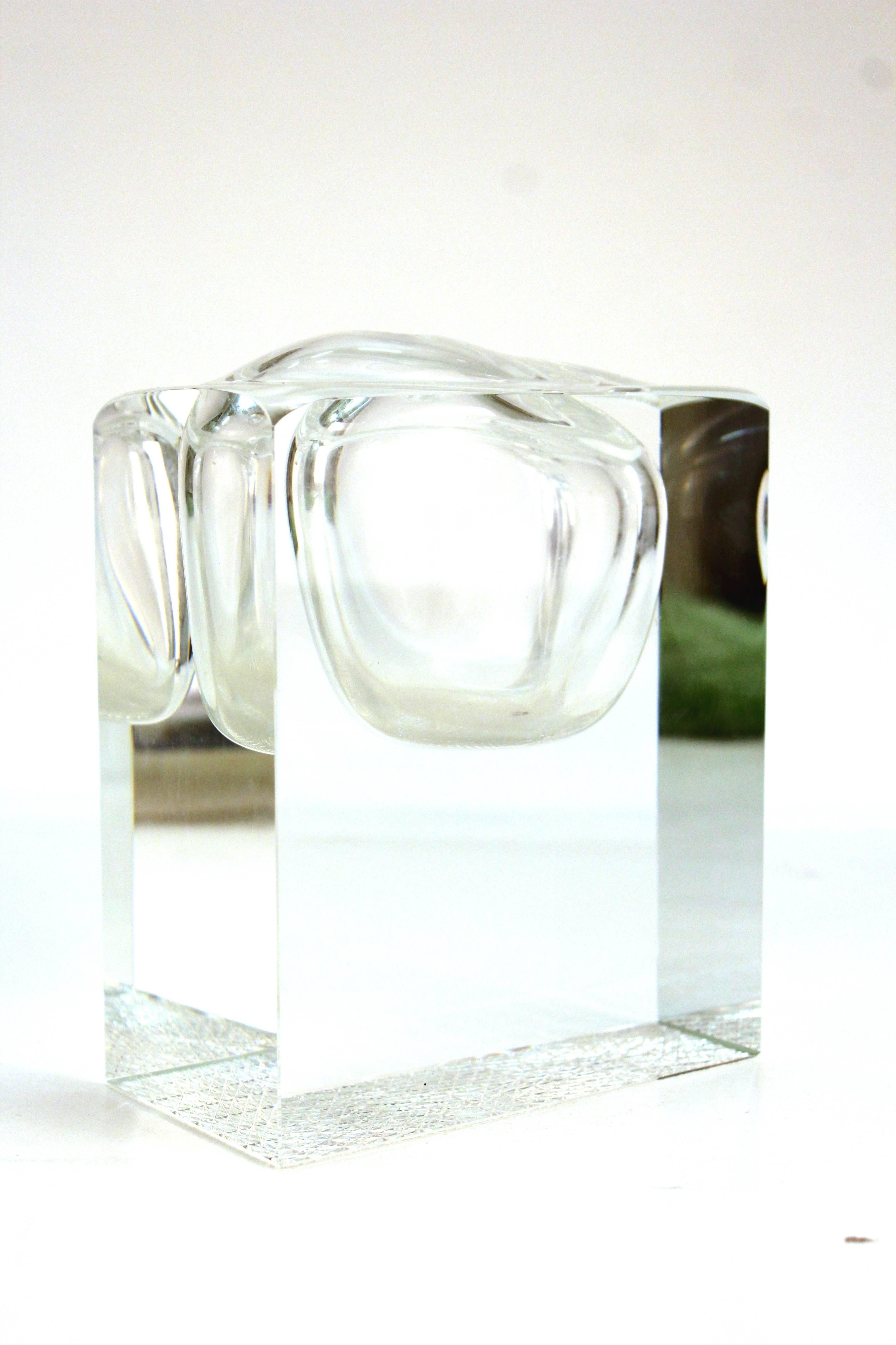 A Mid-Century Modern geometric lead crystal vase. Formed to look like a bubble in a larger block of crystal. Includes a hole at the top big enough for a single flower. The piece is illegibly signed. Despite a minor scratch on one side the piece is
