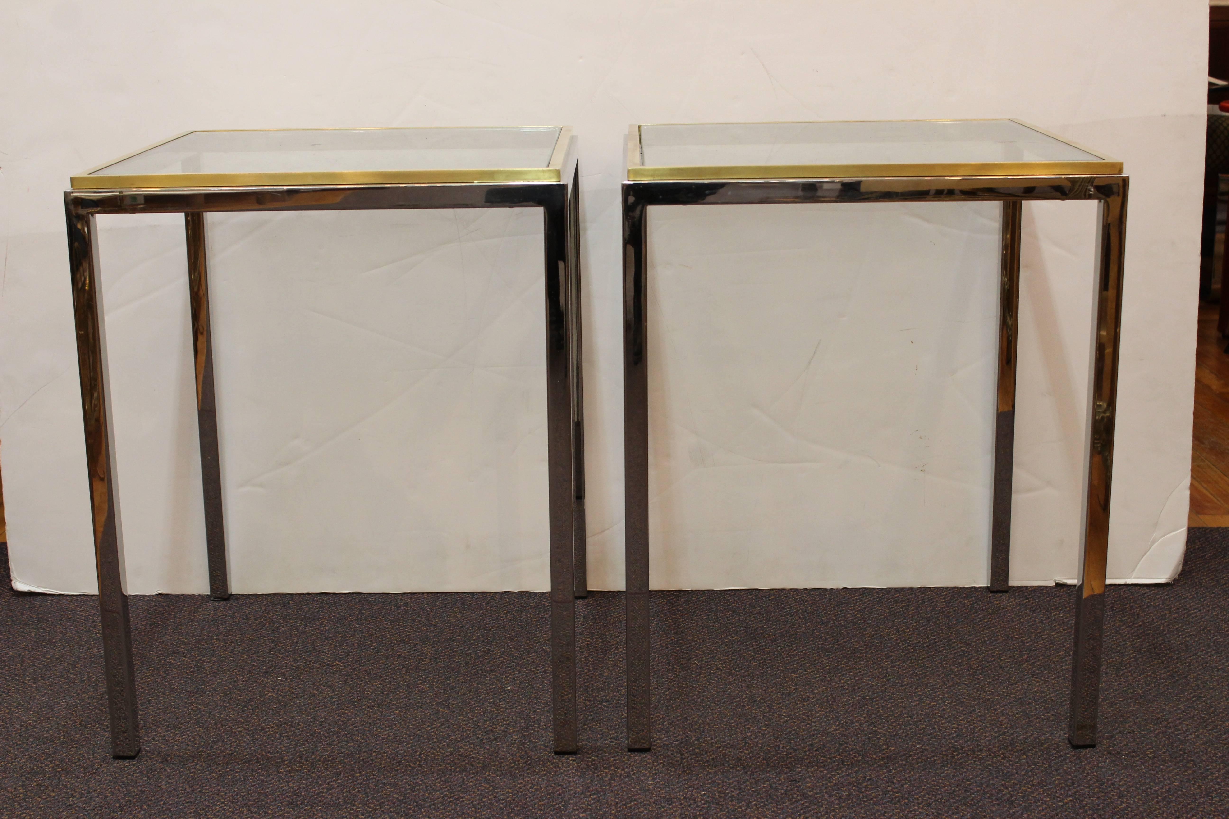 Pair of side tables attributed to Romeo Rega or Renato Zevi. The tables have square glass tops rimmed in brass. Manufactured in Italy during the 1970s, the side tables remain in good vintage condition with no pitting to chrome and minor scuffs.
