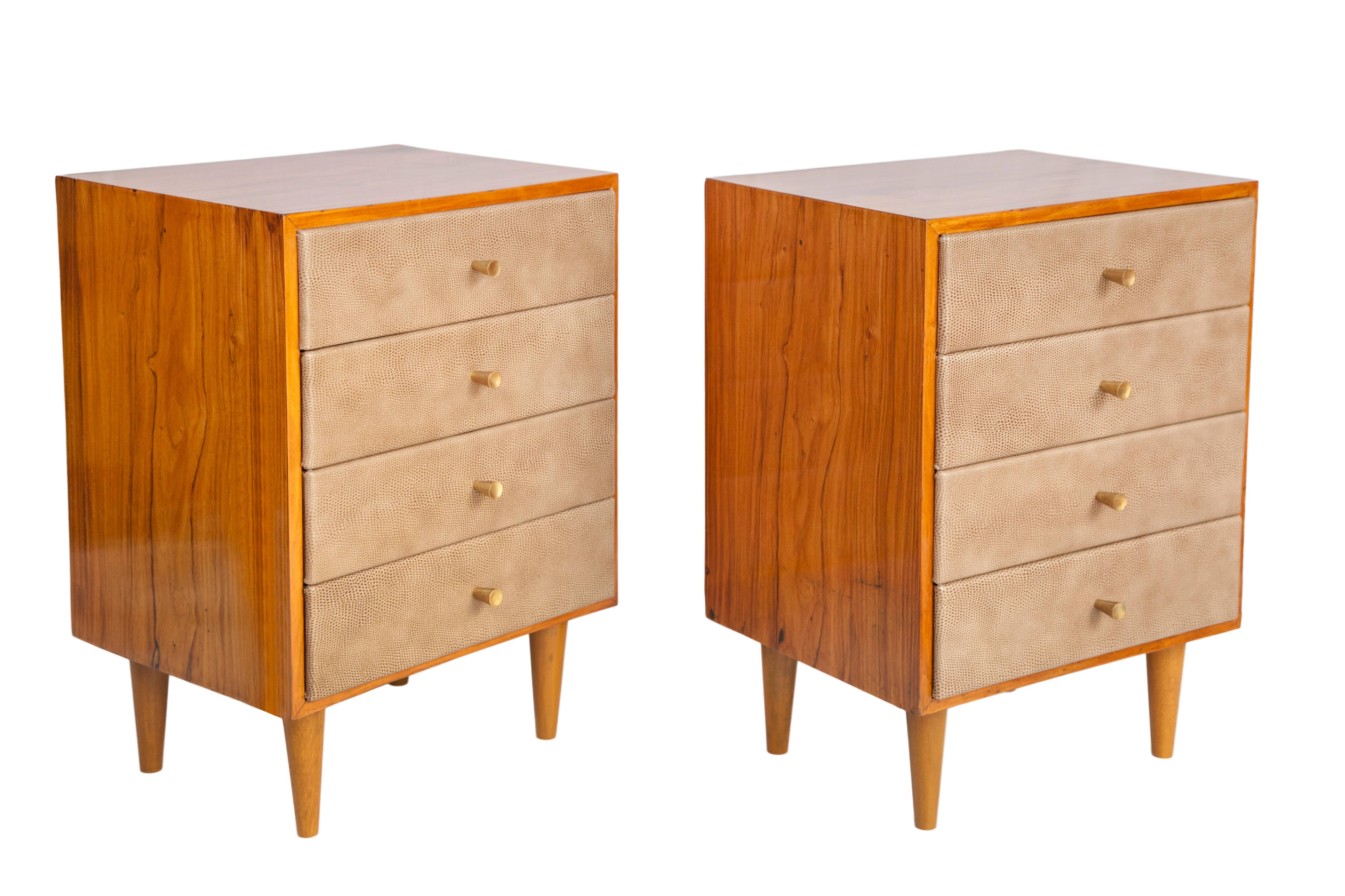 Midcentury dressers in Brazilian caviuna wood from the 1950s. Each has recently upholstered drawers with shagreen leatherette. Each has four drawers with a circular brass drawer pull in the centre. These dressers are each in good vintage condition
