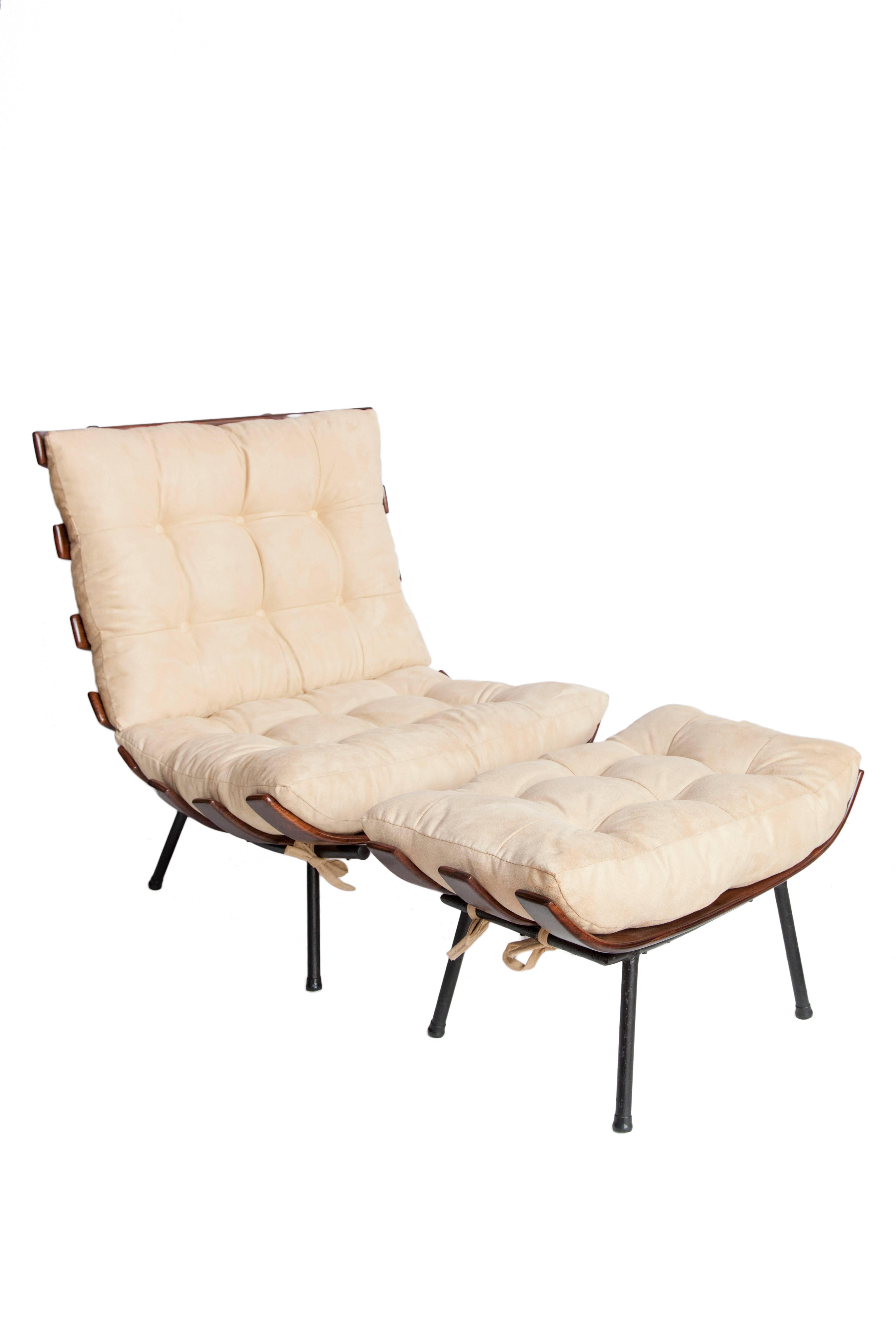 Rib chairs (also called Costela chairs) designed by Martin Eisler and Carlo Hauner in Brazilian caviuna wood and metal. These chairs are iconic Brazilian mid-century modern pieces, date from ca. 1950 and come with matching ottomans. Each chair and