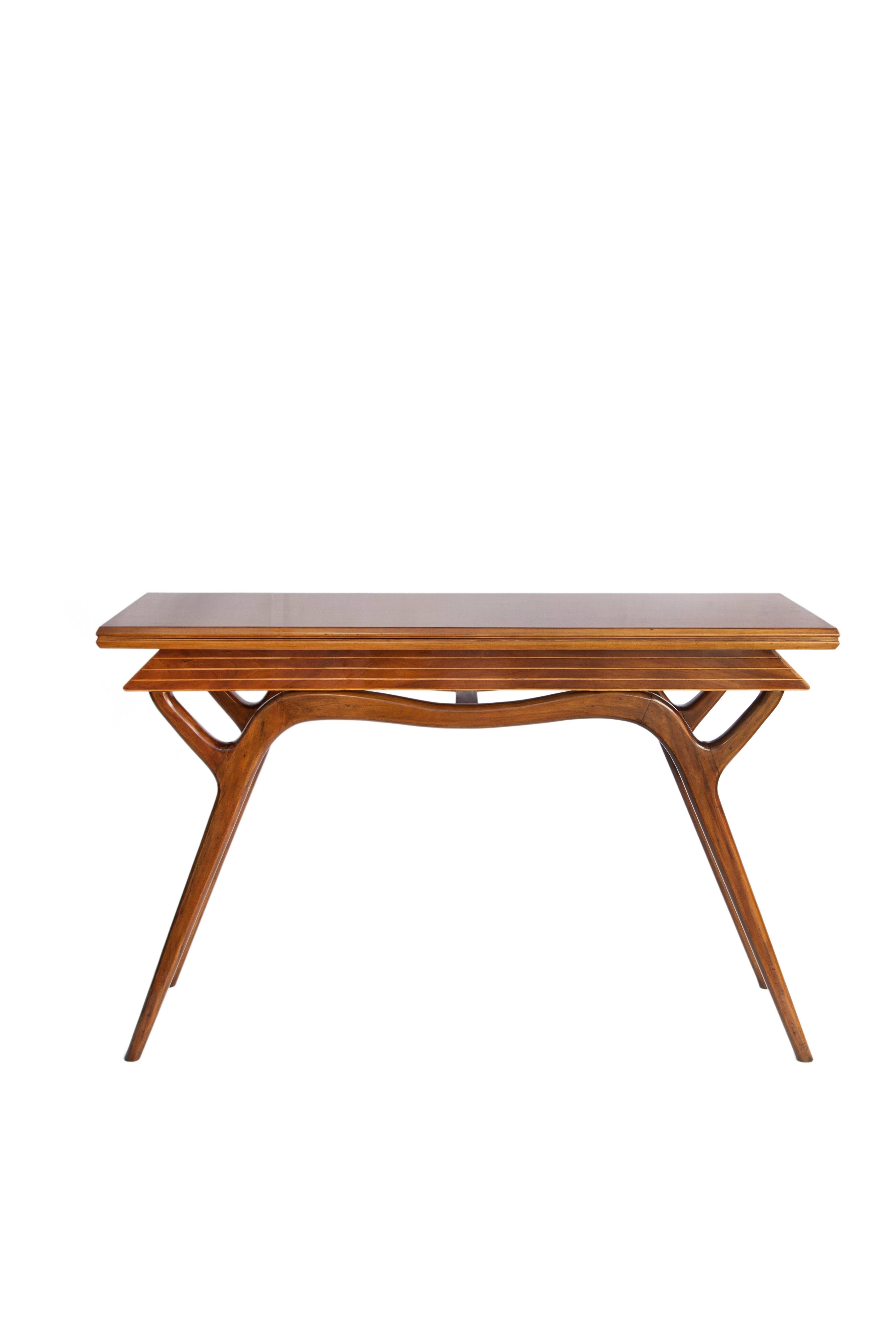 Giuseppe Scapinelli expandable console. Produced during the 1950s in Brazil in Caviuna wood. The table top unfolds to form a dining table. The piece is in good vintage condition with wear consistent to age and use.