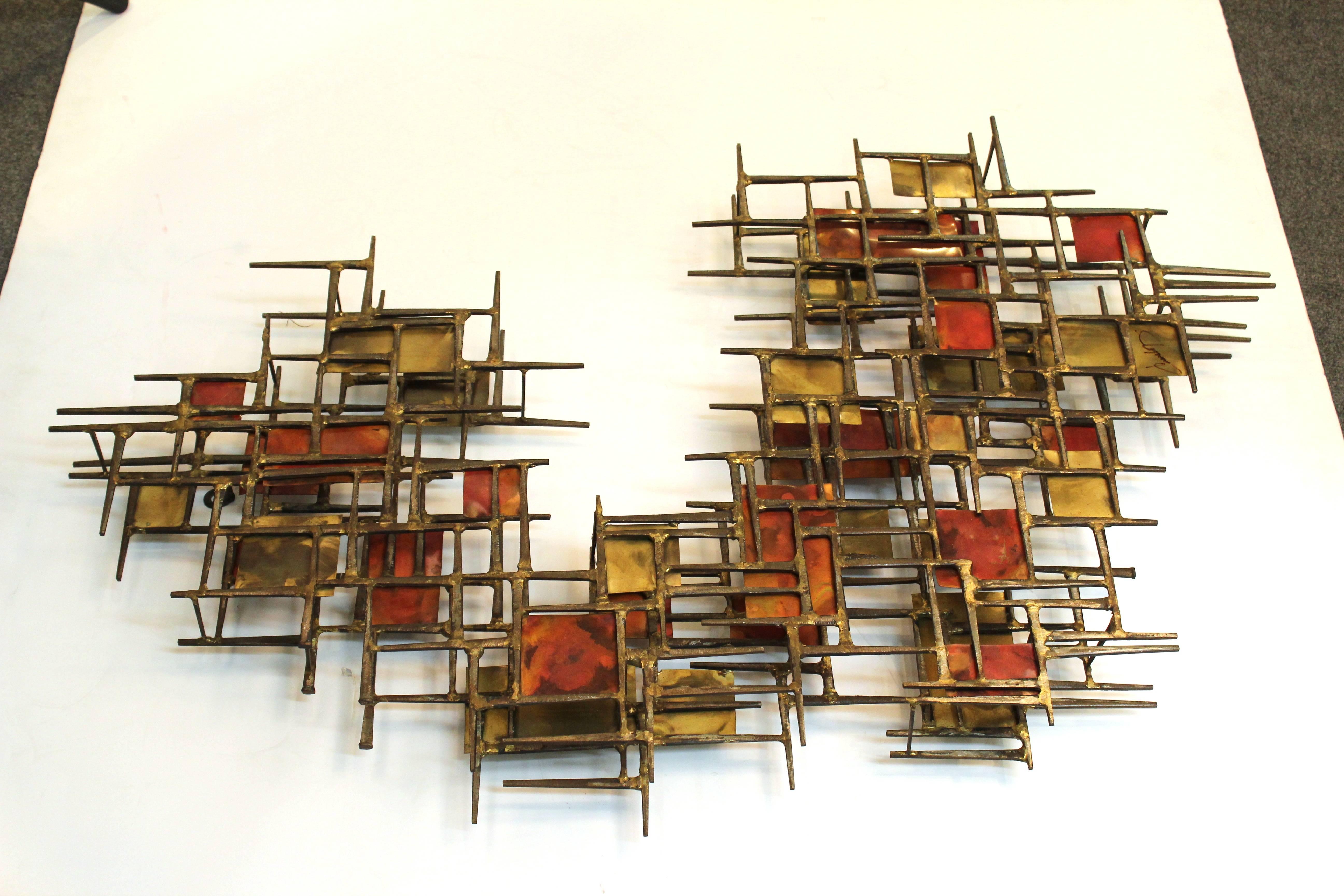 A welded copper, iron and brass wall sculpture consisting of an assemblage of nails. The piece was crafted in the 1980s and is signed illegibly on the front. The item is in great vintage condition with some wear appropriate to age and use.