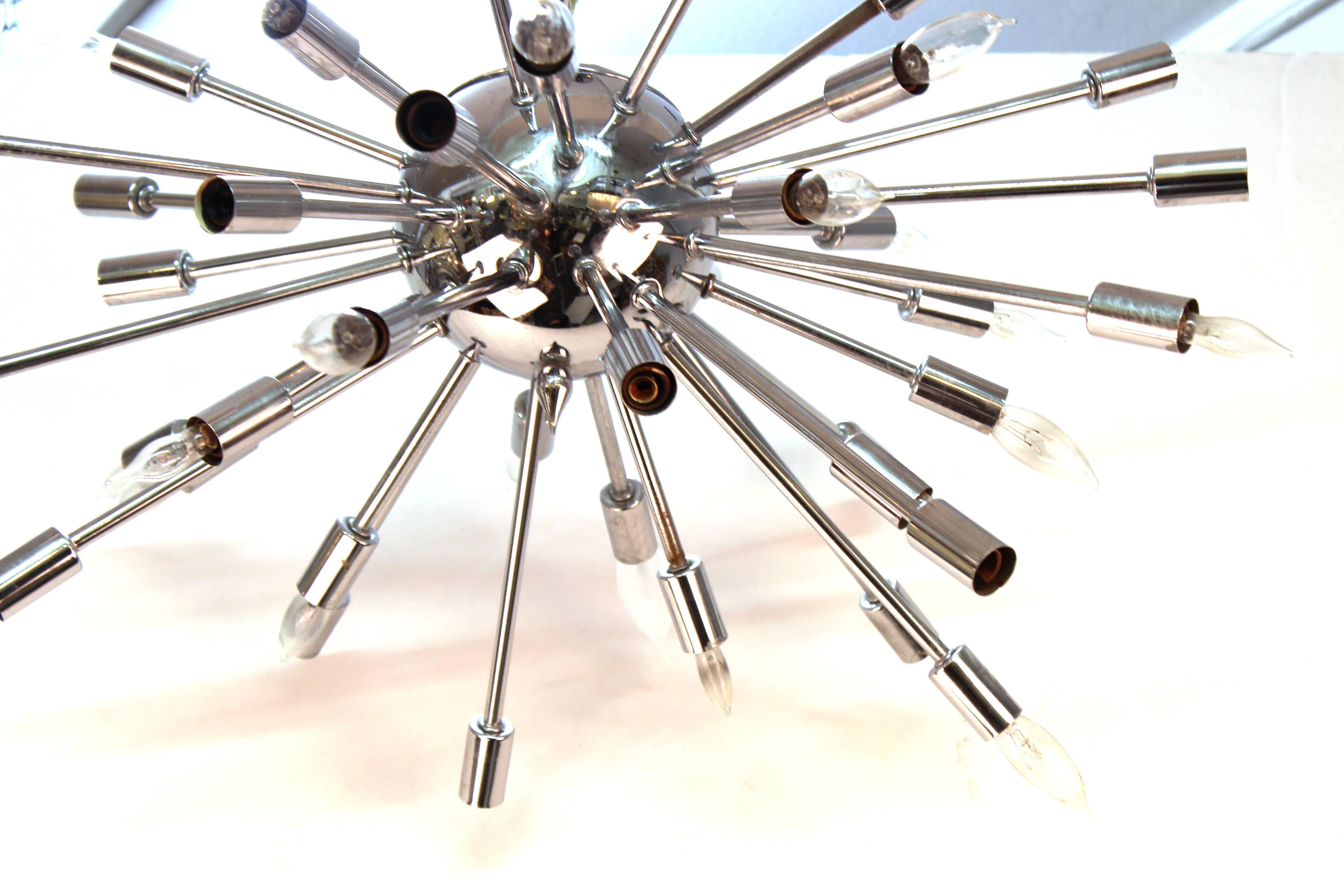 A Mid-Century Modern Sputnik chandelier in chrome, with a multitude of arms. The piece is in great vintage condition with age-appropriate use.