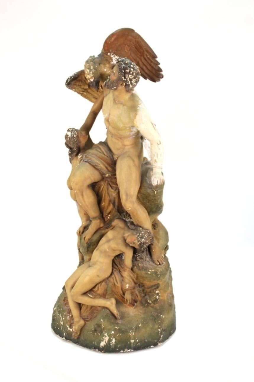 After, Eduard Muller (German 1828-1895) this vintage cast and painted sculpture is of the titan Prometheus and features an eagle and swooning nudes at his feet. Titled 'Prometheus Bound and the Oceanids'- this sculpture is in overall good vintage