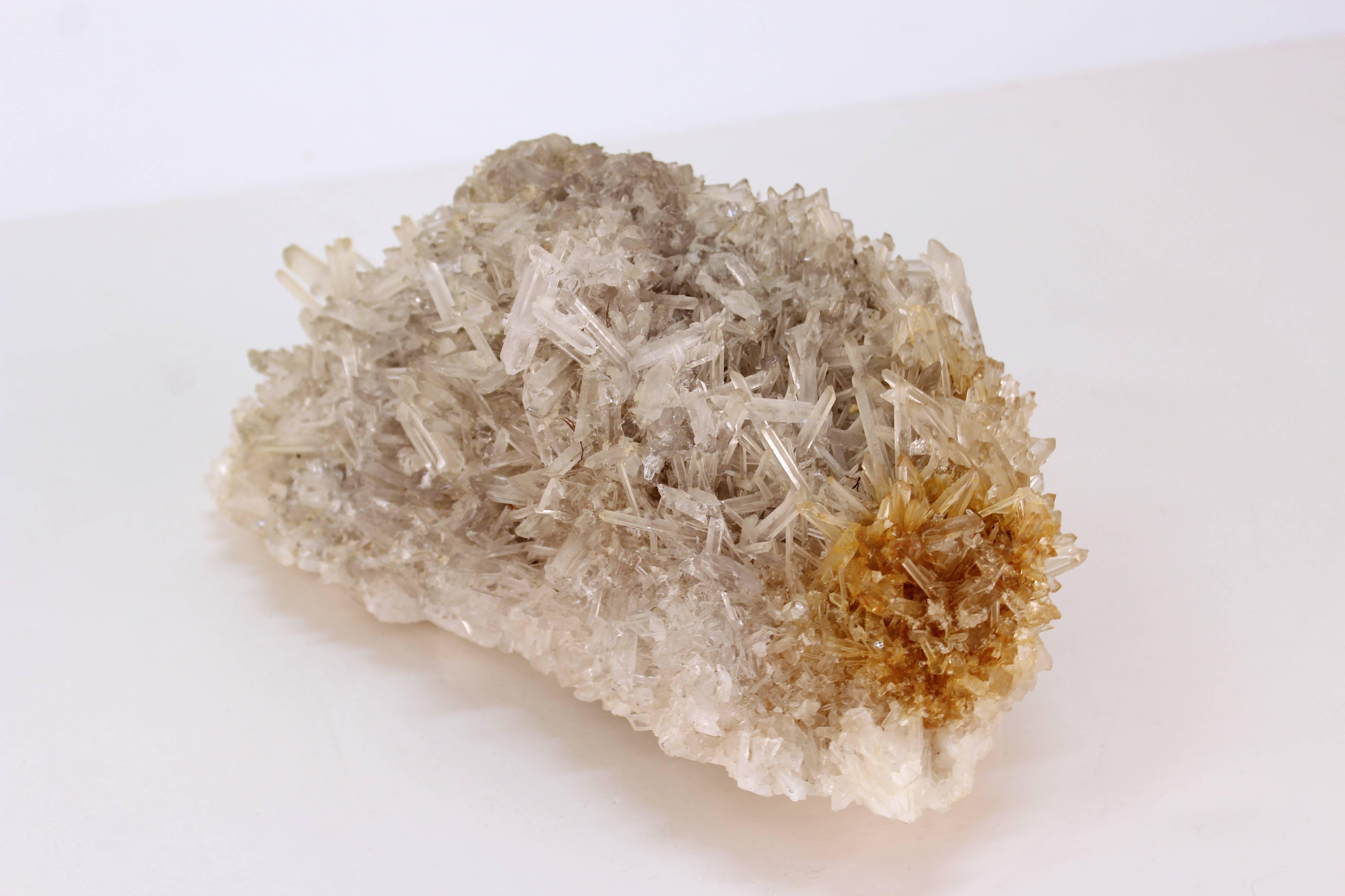 A decorative geode formation. Made up of numerous bursts of clear, white and brown crystals. The sample is roughly cut and in good condition. 