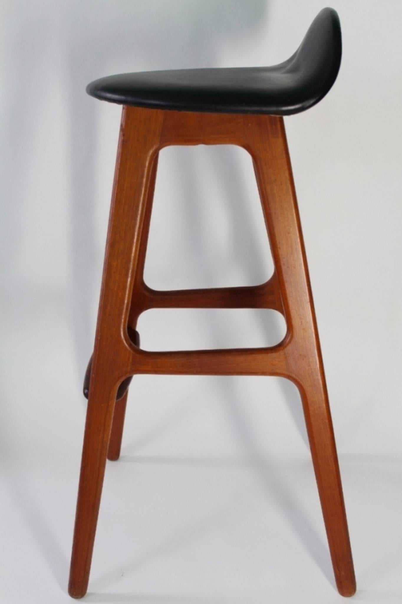 Danish modern teak stool designed by Erik Buch for Oddense Maskinsnedkeri. The stool features its original label. In very good vintage condition having wear consistent with age and use. 

Only one available.