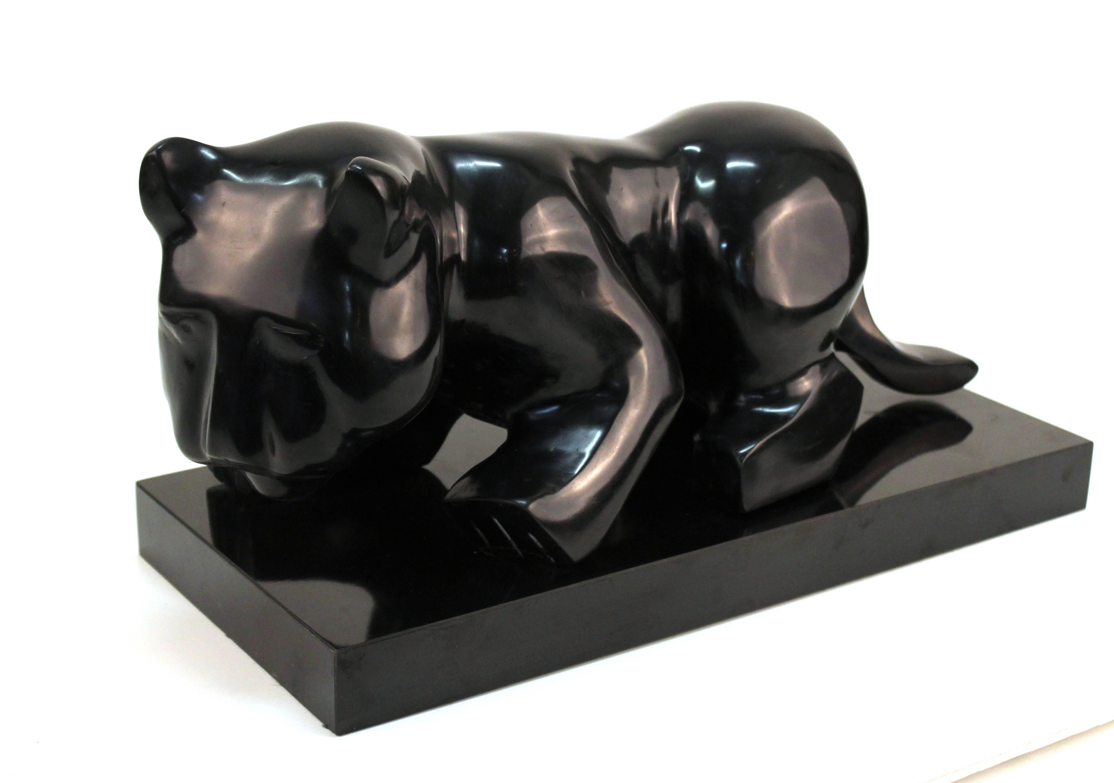 Cat sculpture on long rectangular stand. Made up of Minimalist geometric forms with a black glossy finish. Signed [N=]. Wear consistent with use. The piece is in good condition.