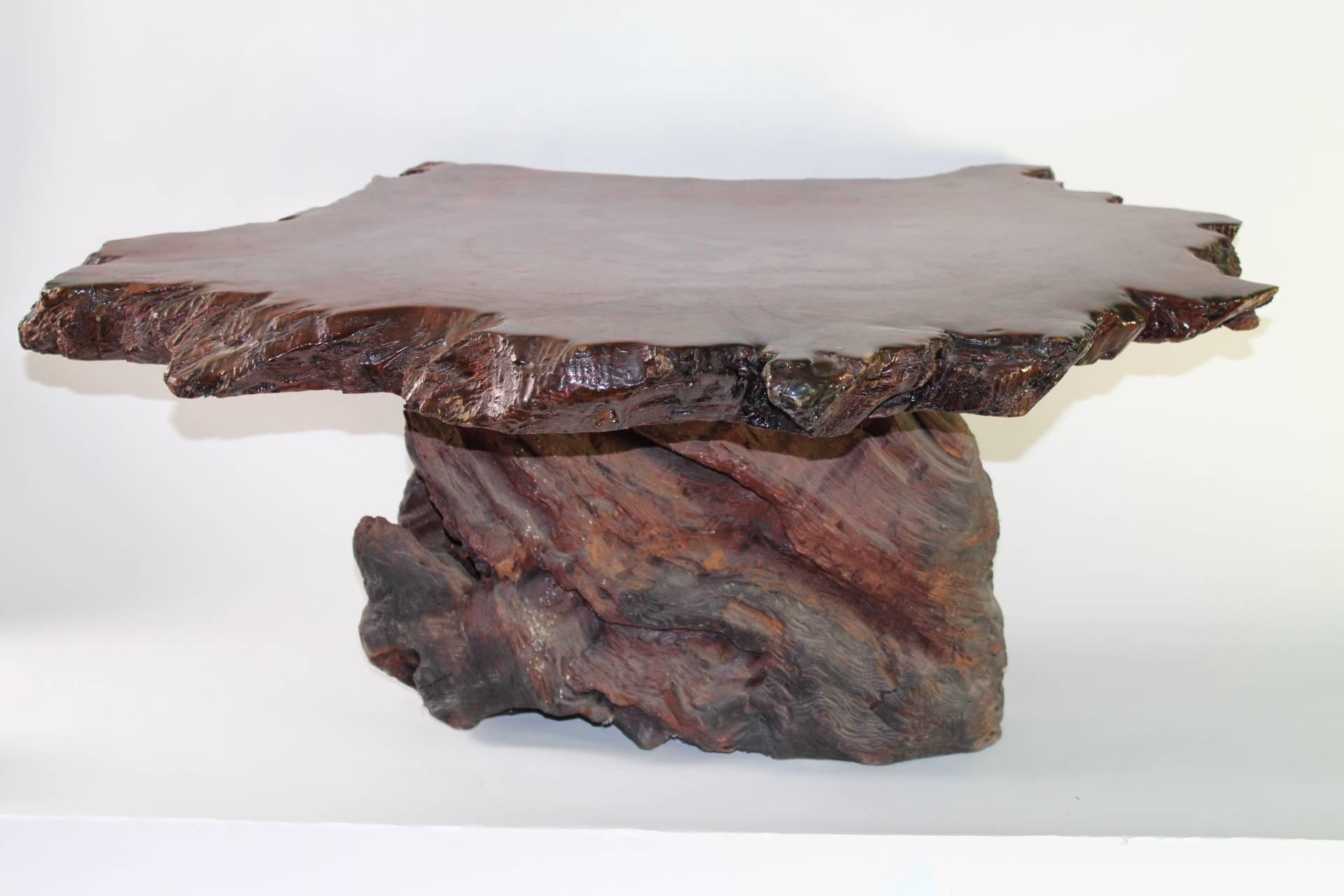 Coffee table in redwood from the 1960s. With raw edges and organic form. Includes a lacquered over top. Wear appropriate to age and use. The piece is in good vintage condition.