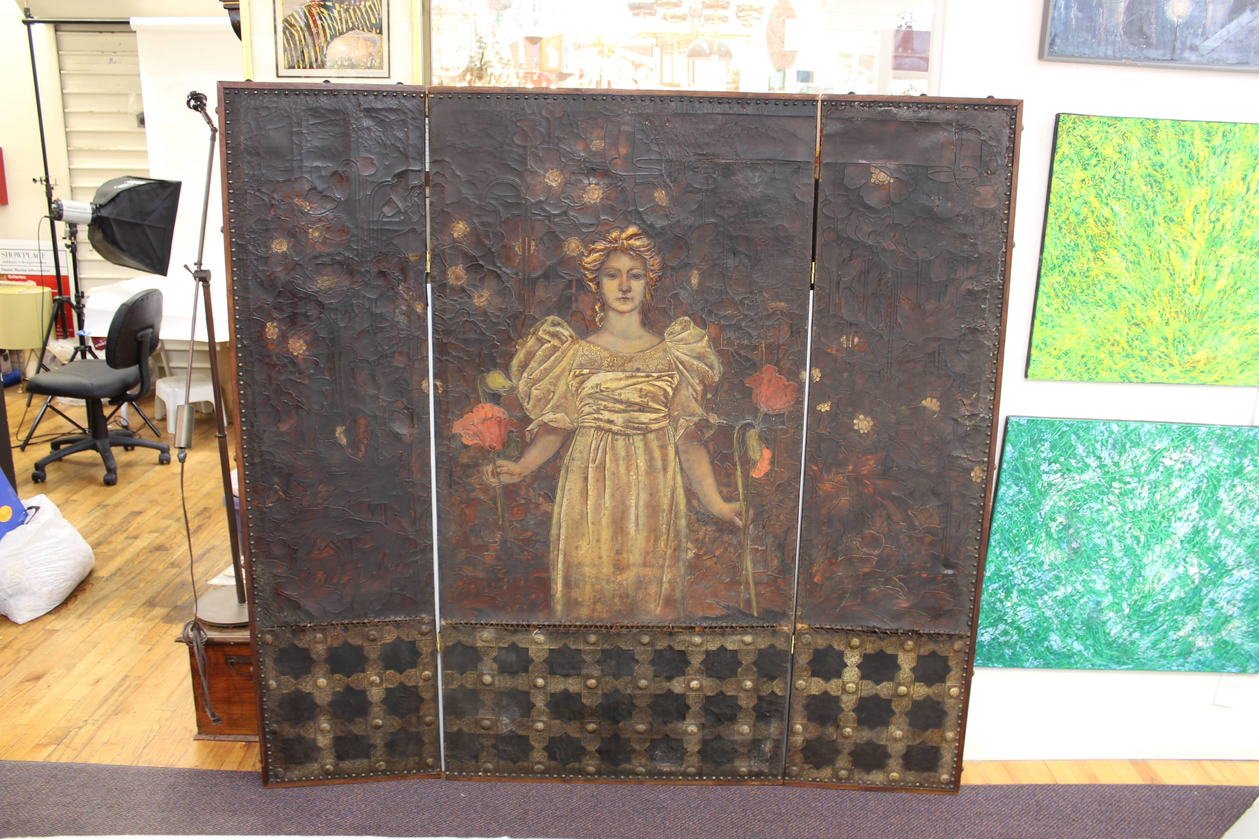 George Hulbe Art Nouveau painted three-part screen. Dates from 1890 Germany. Hulbe was known for his creative leather designs. This screen depicts a beautiful young woman surrounded by poppy flowers. The bottom of the screen is bordered in an