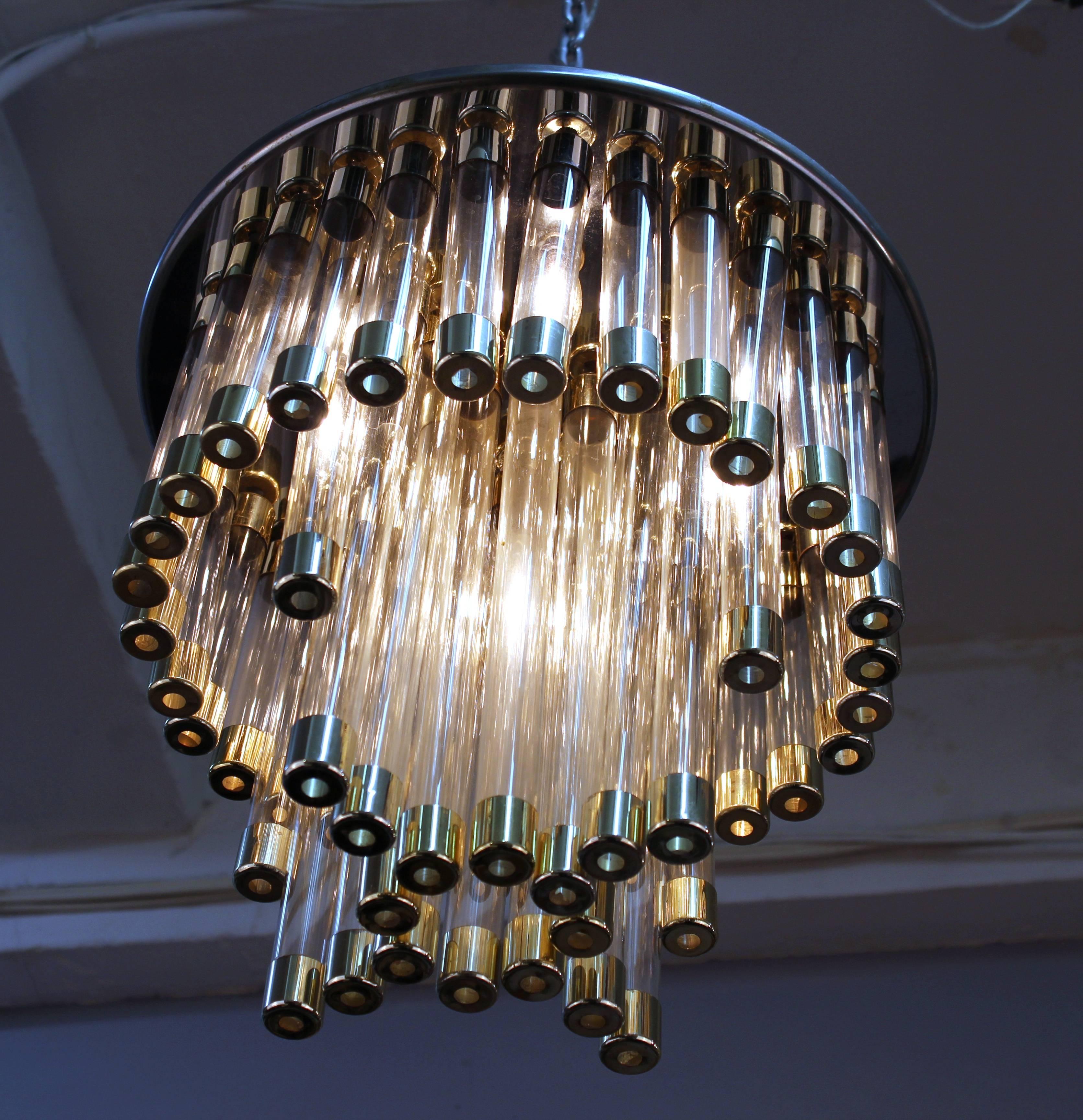 A Mid-Century Modern chandelier with chrome structure on a circular base with chrome and glass tube pendants. The piece is in good vintage condition and has been rewired to US standards.