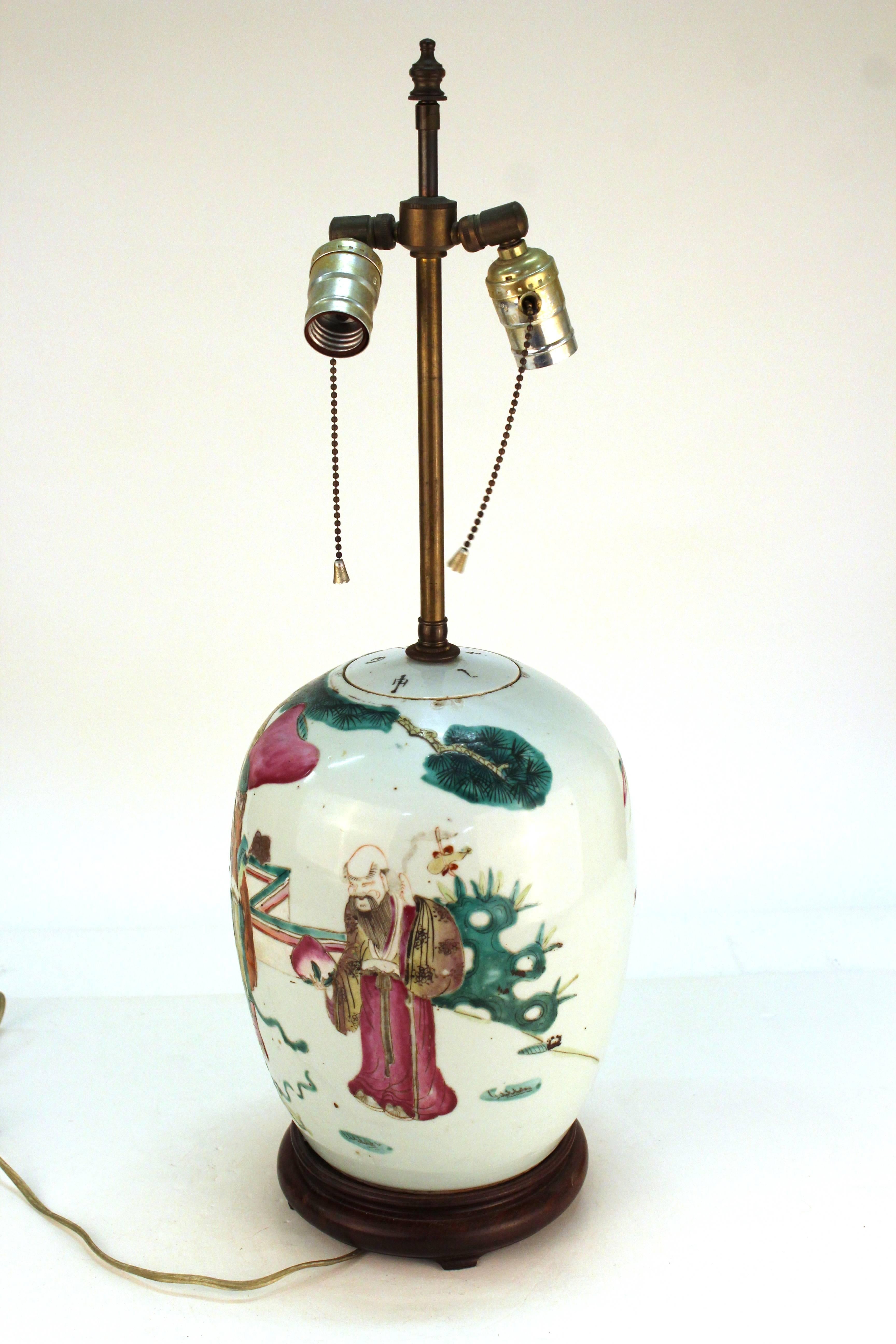 A Chinese porcelain jar of the Famille Rose, modified to function as a table lamp. The piece is in good vintage condition with age-appropriate wear.