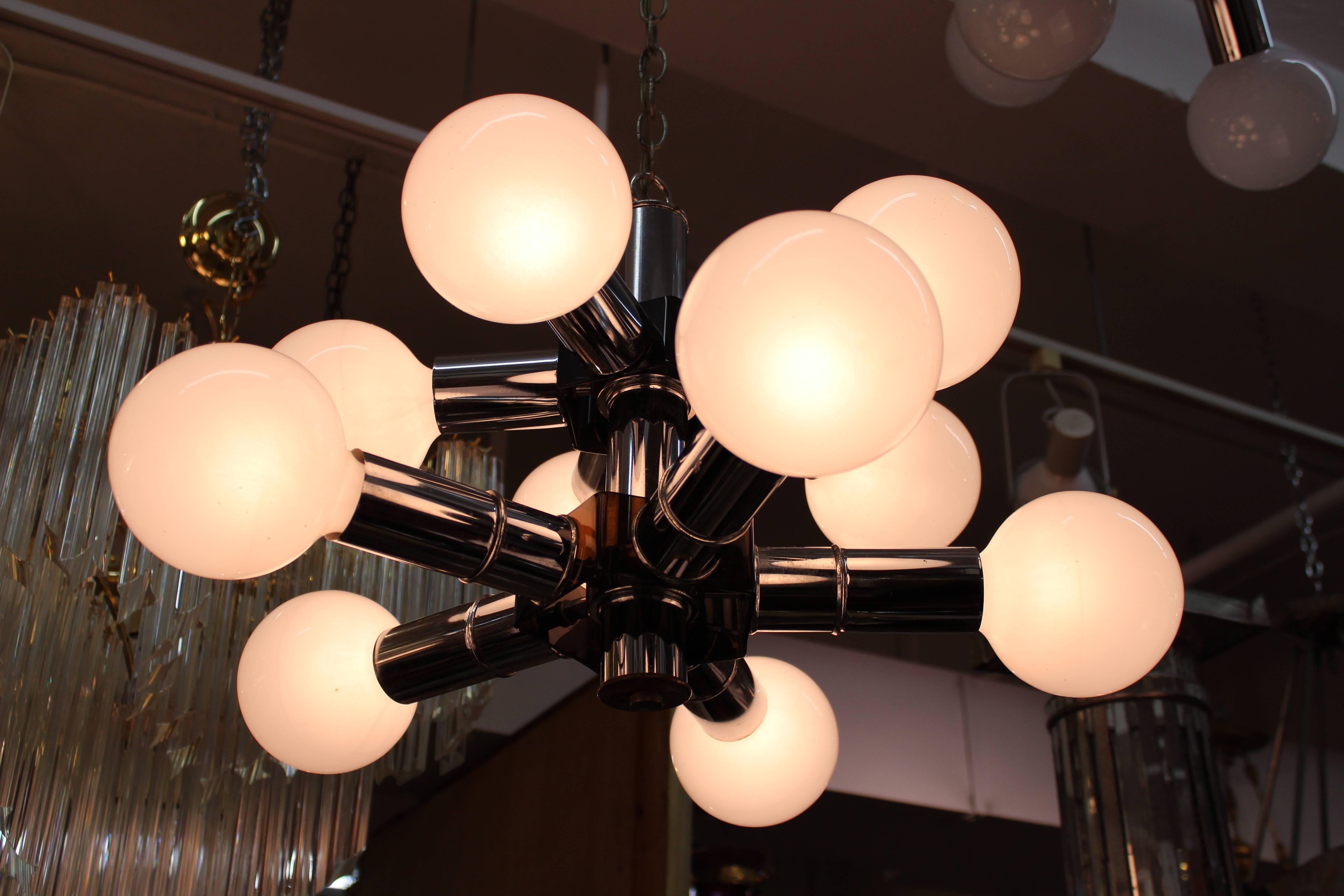 Mid-Century Modern molecular style chandelier with a two-tiered chrome structure and white glass globes, made during the Atomic age. The piece is in great vintage condition.