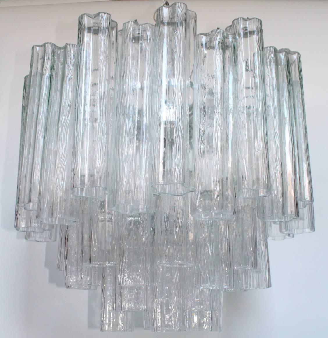 Vintage Tronchi chandelier in the style of Venini comprised of suspended tubular glass pieces hanging from a chrome frame. This chandelier has nine sockets, a long chain (not included in the dimensions) that can be adjusted if needed. This piece is