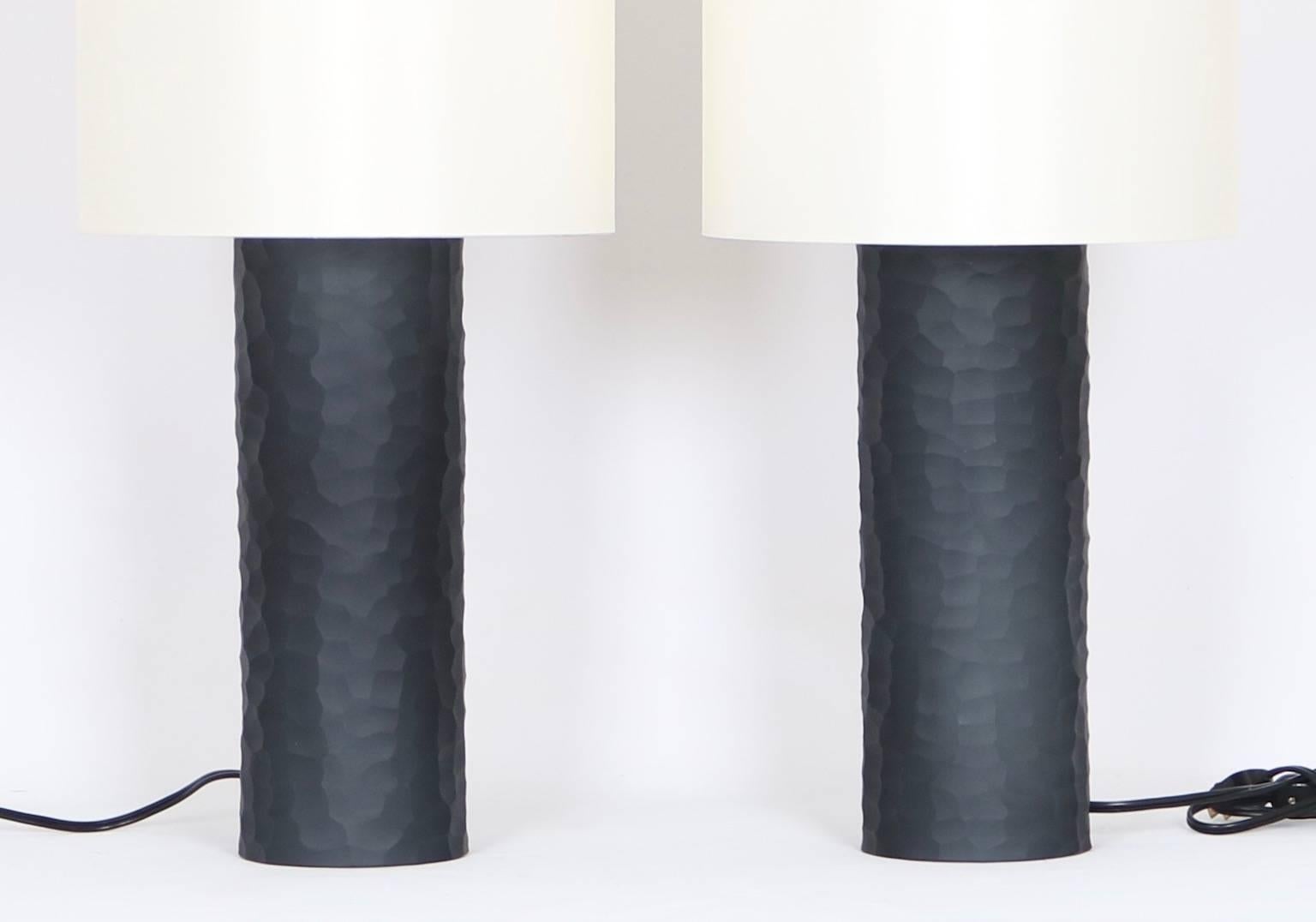 Cylindrical table lamps by Vivarini for Formia in black battuto Murano glass, signed and dated to the top of the lamps. These lamps have never been used and come with silk paper shades.

The listed height is to the top of the shade; the height of