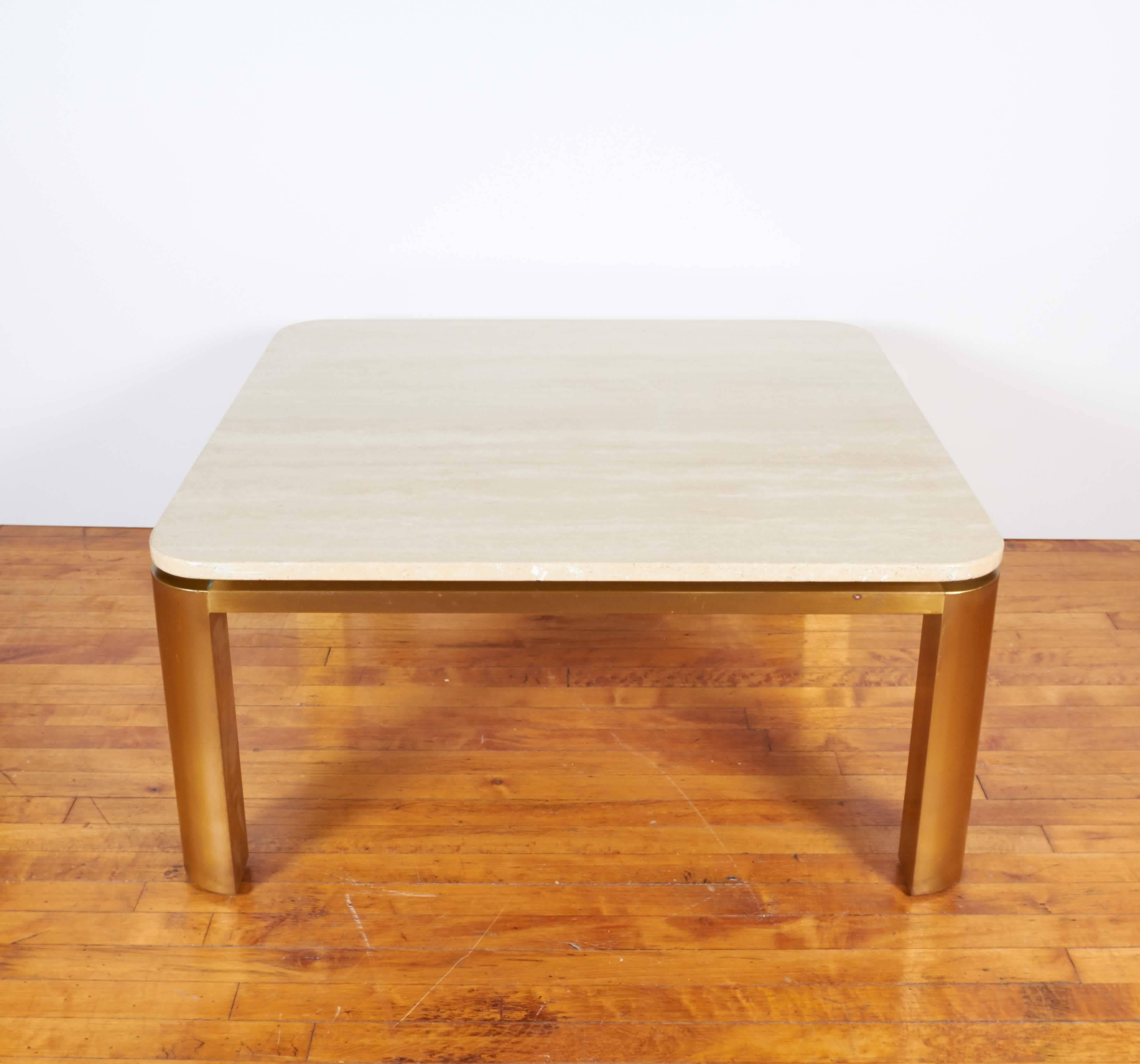 A square coffee and cocktail table by Leon Rosen, produced, circa 1970s by Pace Collection, featuring a floating travertine top with rounded corners, over a brass base; travertine top 3/4