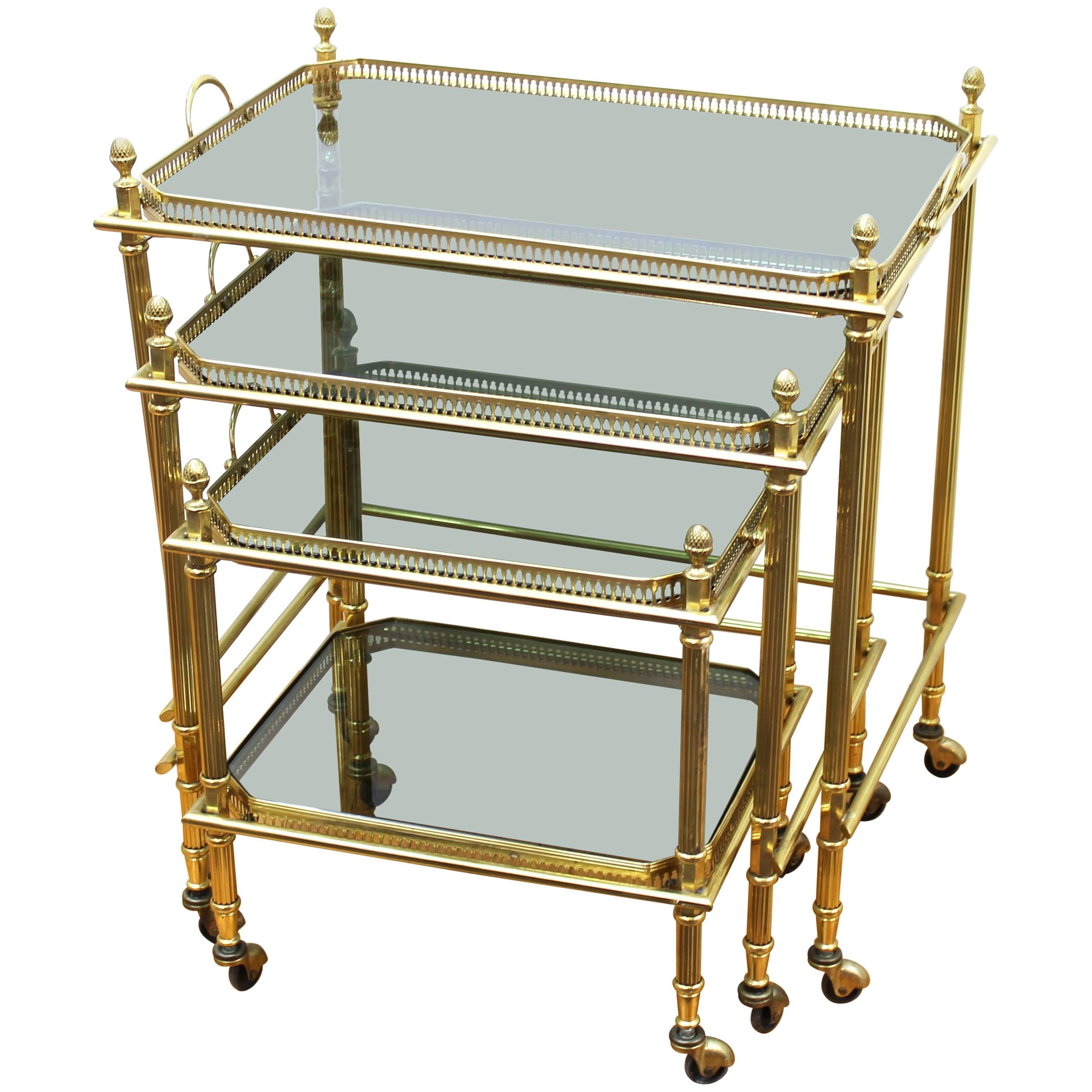 Maison Baguès Nesting Tables in Brass and Smoked Glass on Casters