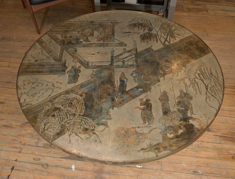A large scale coffee and cocktail table, created by Manhattan based designers Philip and Kelvin LaVerne, circa 1960s, with acid etched, patinated and polychromed detailing in bronze against pewter, depicting raised images of scenes of an Asian