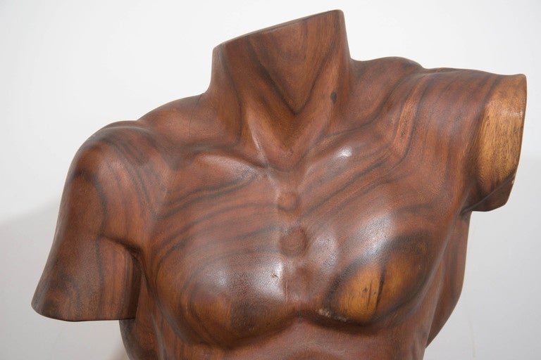 A vintage sculpture of an academic male torso, posing mid-twist, produced, circa 1970s, carved from exotic tropical mahogany wood from Brazil, with beautiful natural swirls, unsigned, artist unknown. Very good condition, with minimal age appropriate