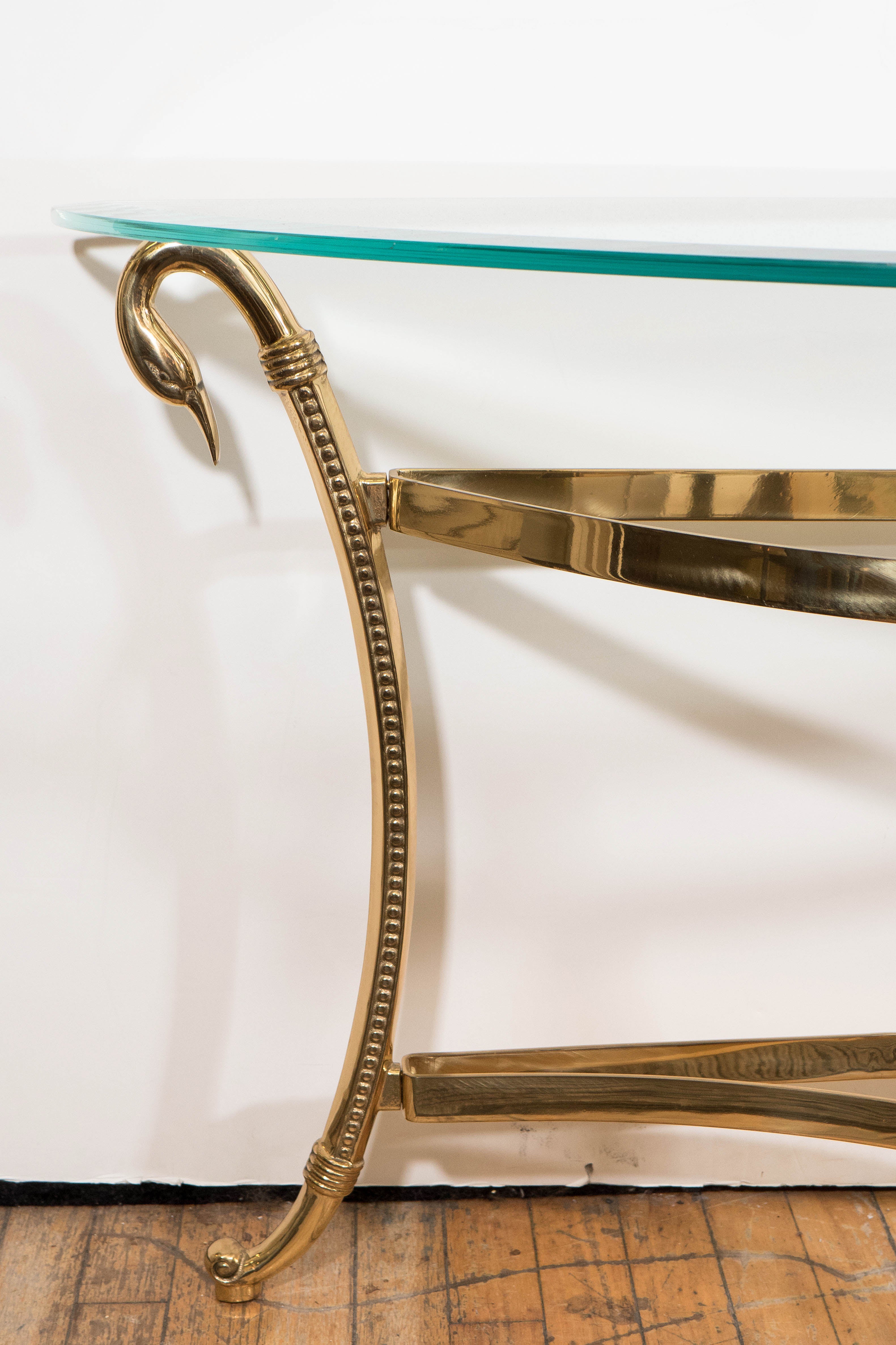 Hollywood Regency A Mid-Century Brass and Glass Top Demi-Lune Console with Swan Head Motif
