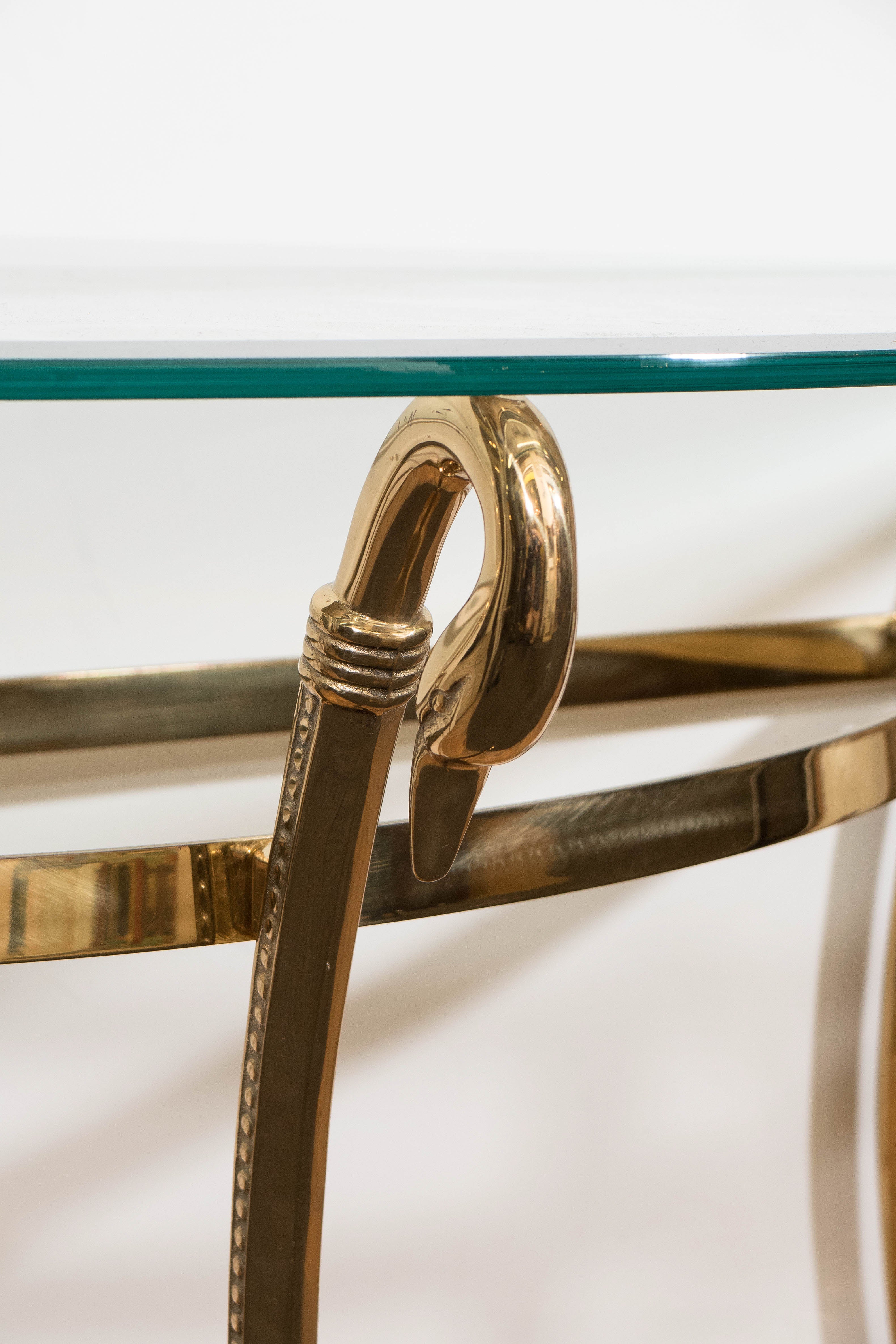 A Mid-Century Brass and Glass Top Demi-Lune Console with Swan Head Motif In Good Condition In New York, NY