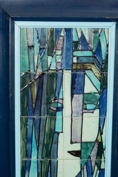 A Pair of Harris Strong Tile Plaques of a Man and Woman