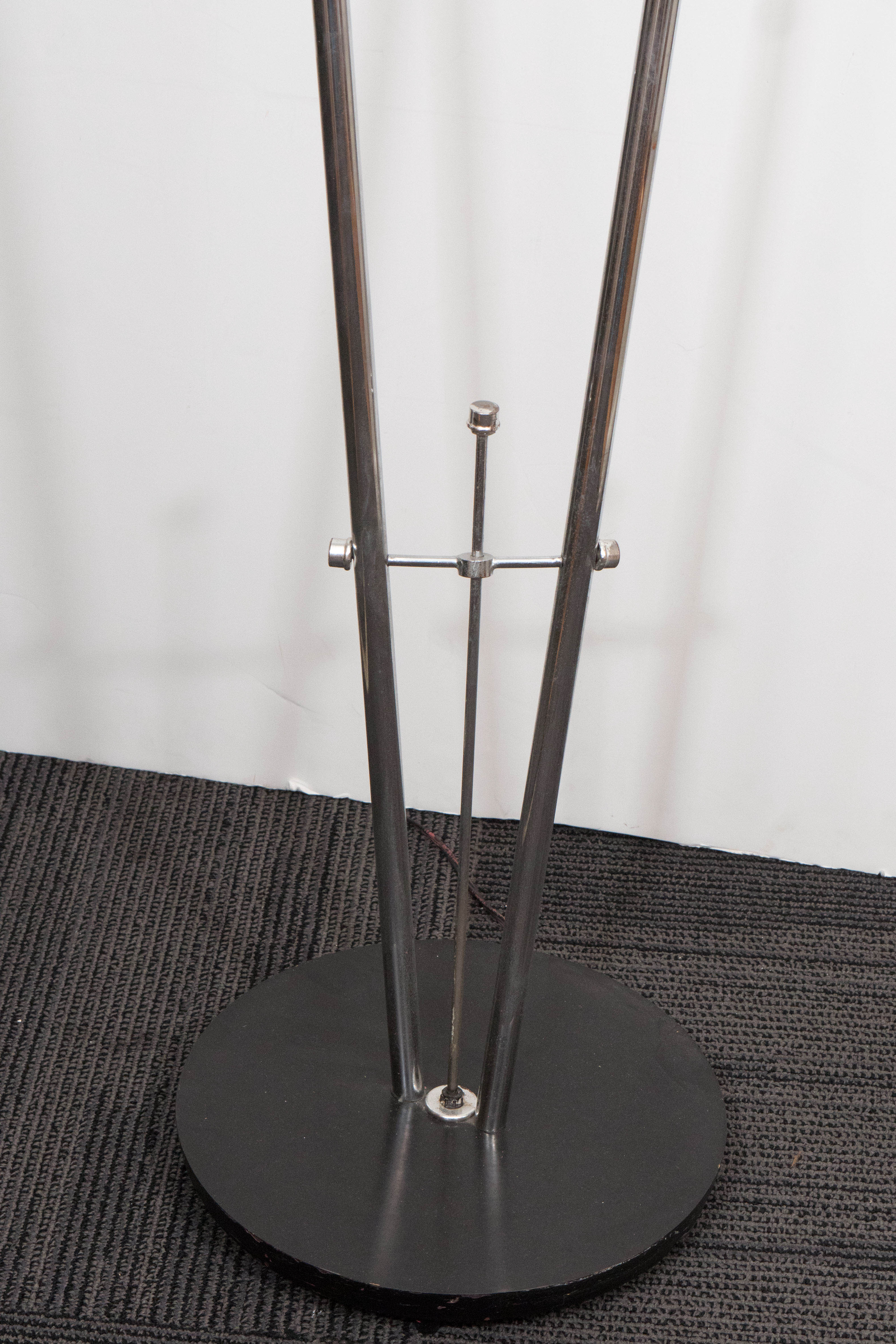 A vintage, highly modernistic standing lamp, produced circa 1960s, with two glass globe shades, each supported by lengthy stems in polished chrome, on black circular bases. Wiring to US standard. Very good vintage condition, with minor wear to the