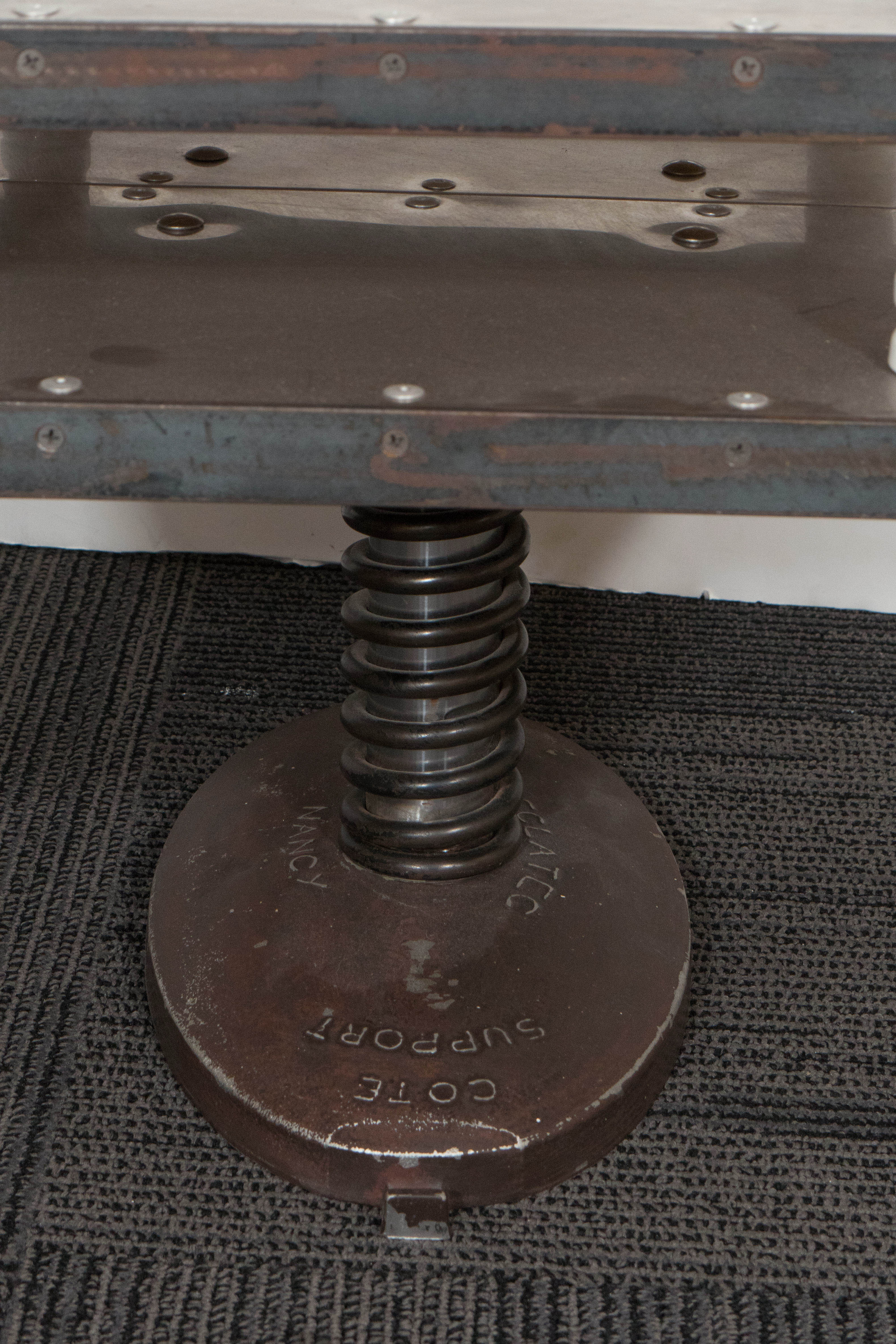 A highly unique vintage two-tier side table, designed in the Industrial mode, produced in France, circa 1940s, in aluminum with mixed metal hardware. Markings include signature 