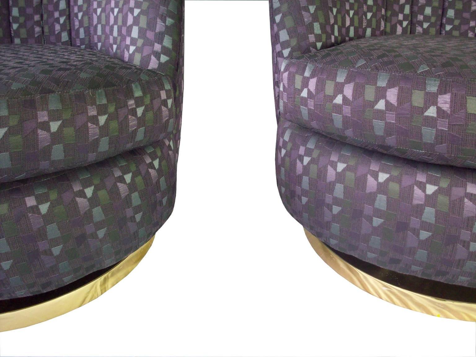 A pair of vintage scallop back lounge chairs, produced, circa 1970s by Milo Baughman, upholstered in purple patterned.

9304