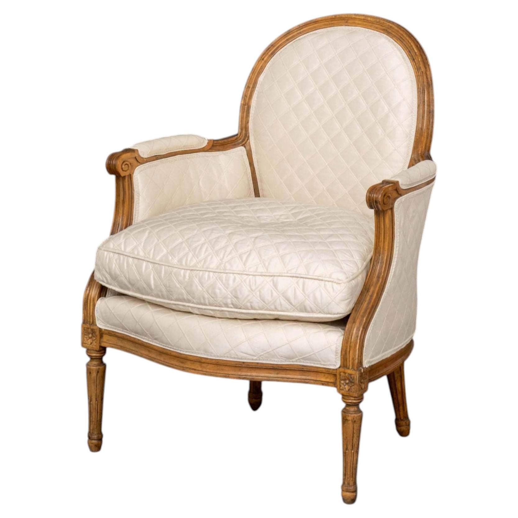 Louis XVI Style Upholstered Walnut Bergere with Diamond Pattern Upholstery For Sale