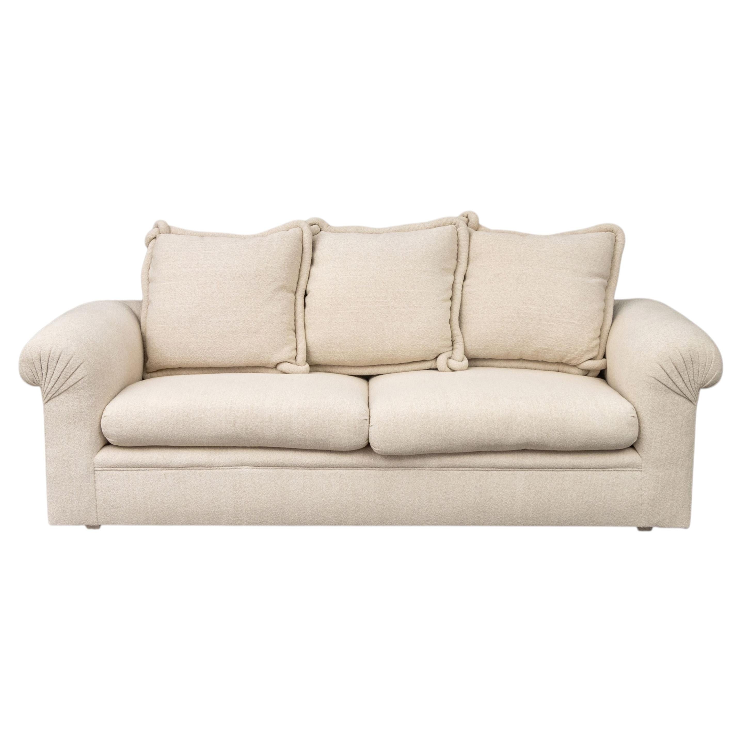 Modern Beige Upholstered Three-Seat Sofa with Throw Pillows